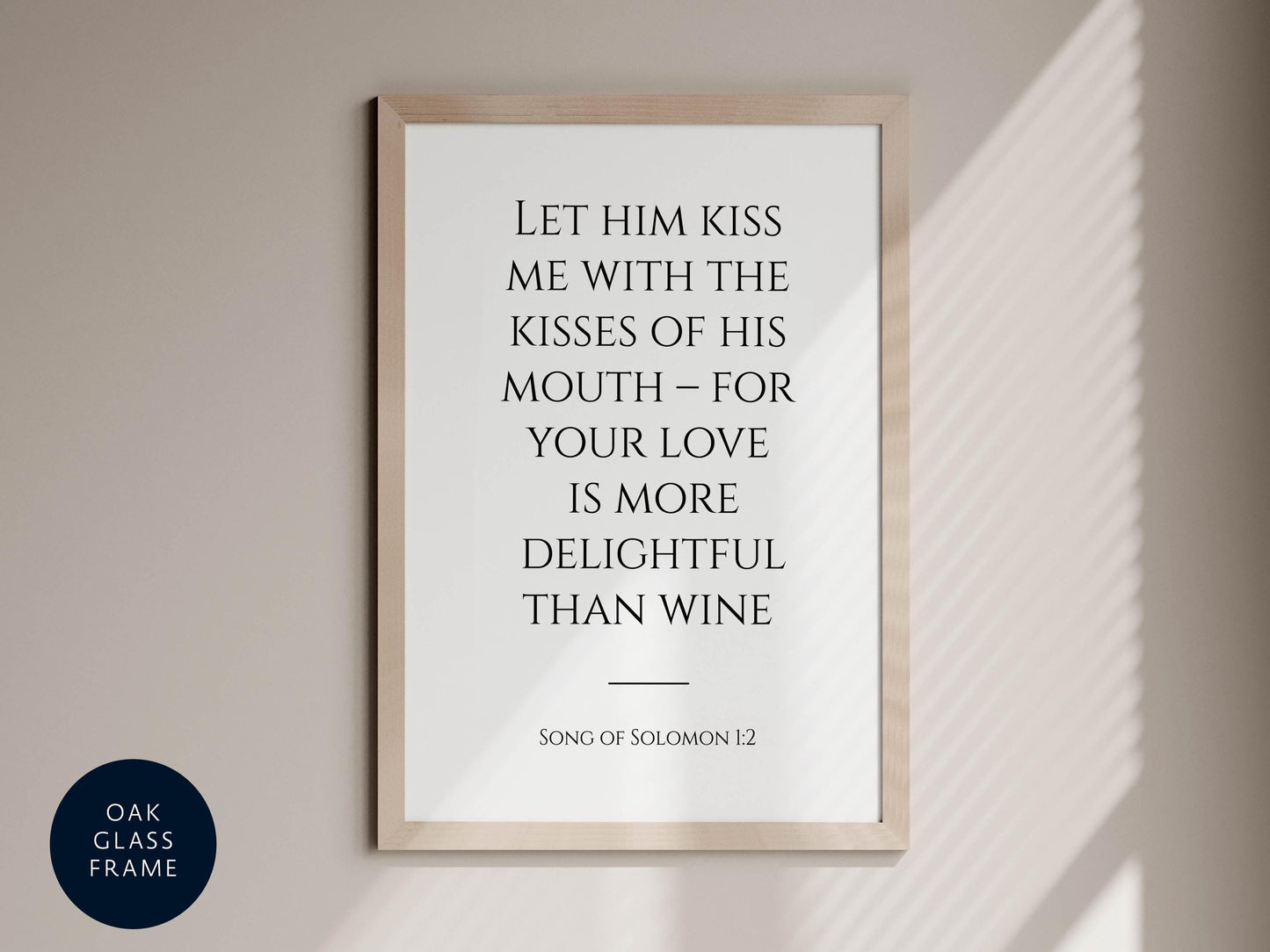 a framed quote from the song of Solomon 1:12, which reads &quot;Let him kiss me with the kisses of his mouth - for your love is more delightful than wine&quot;.