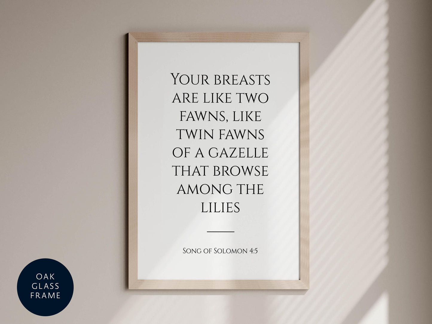 a framed quote from the song of Solomon 4:5, which reads &quot;Your breasts are like two fawns, like twin fawns of a gazelle that browse among the lilies&quot;.
