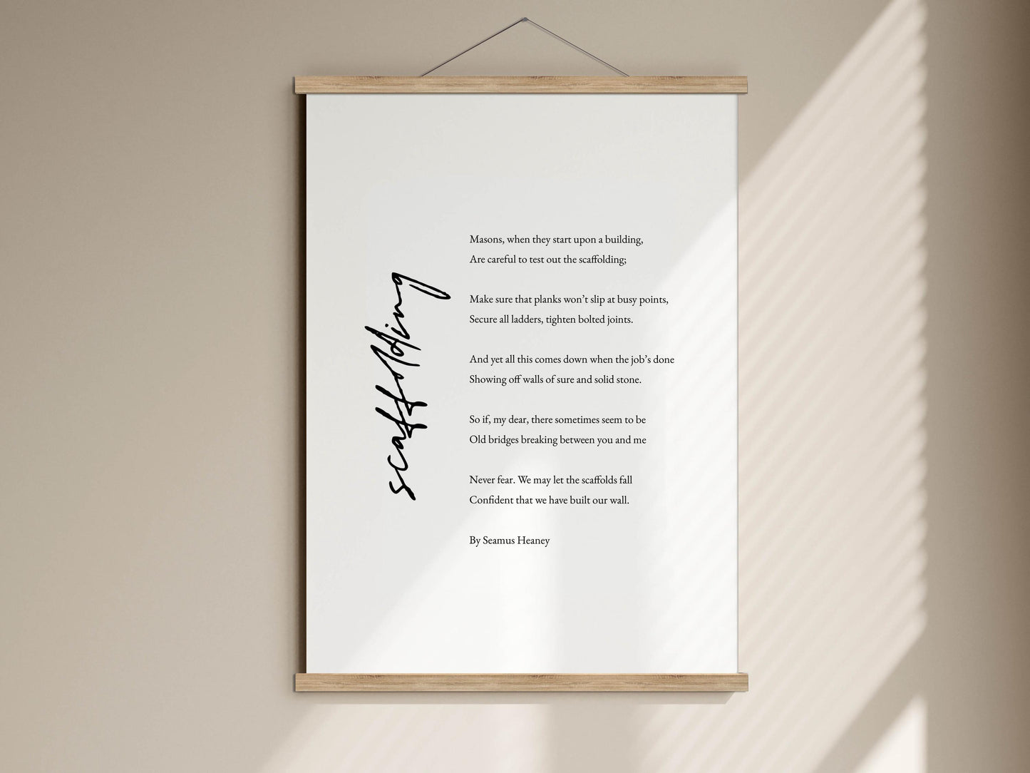 a white poster with black text, hanging on a wall.