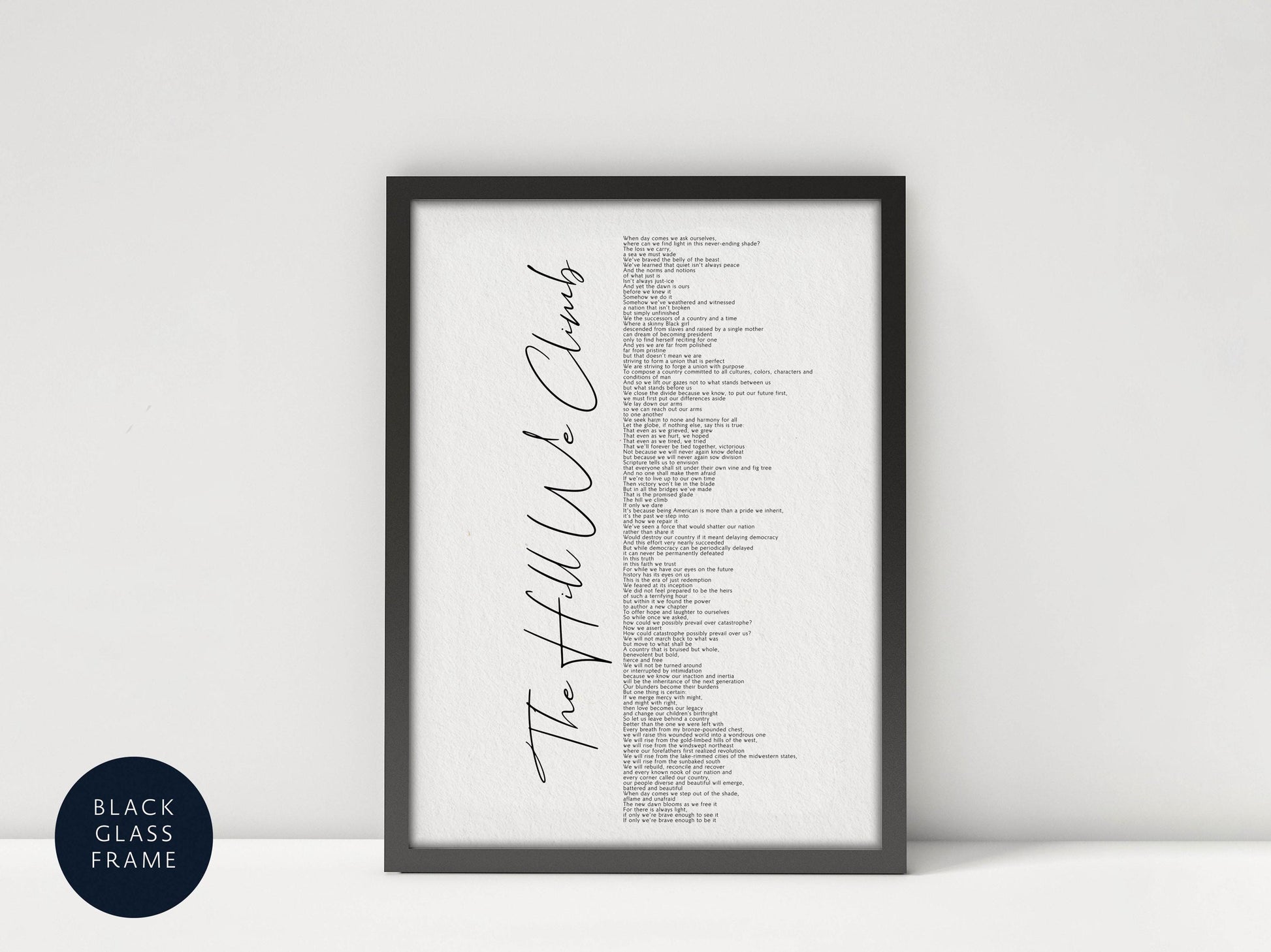 a framed poster with a list of words written in black cursive font, which appears to be a list of names or titles.