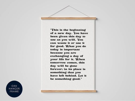 a quote on a white background, hanging on a wall.