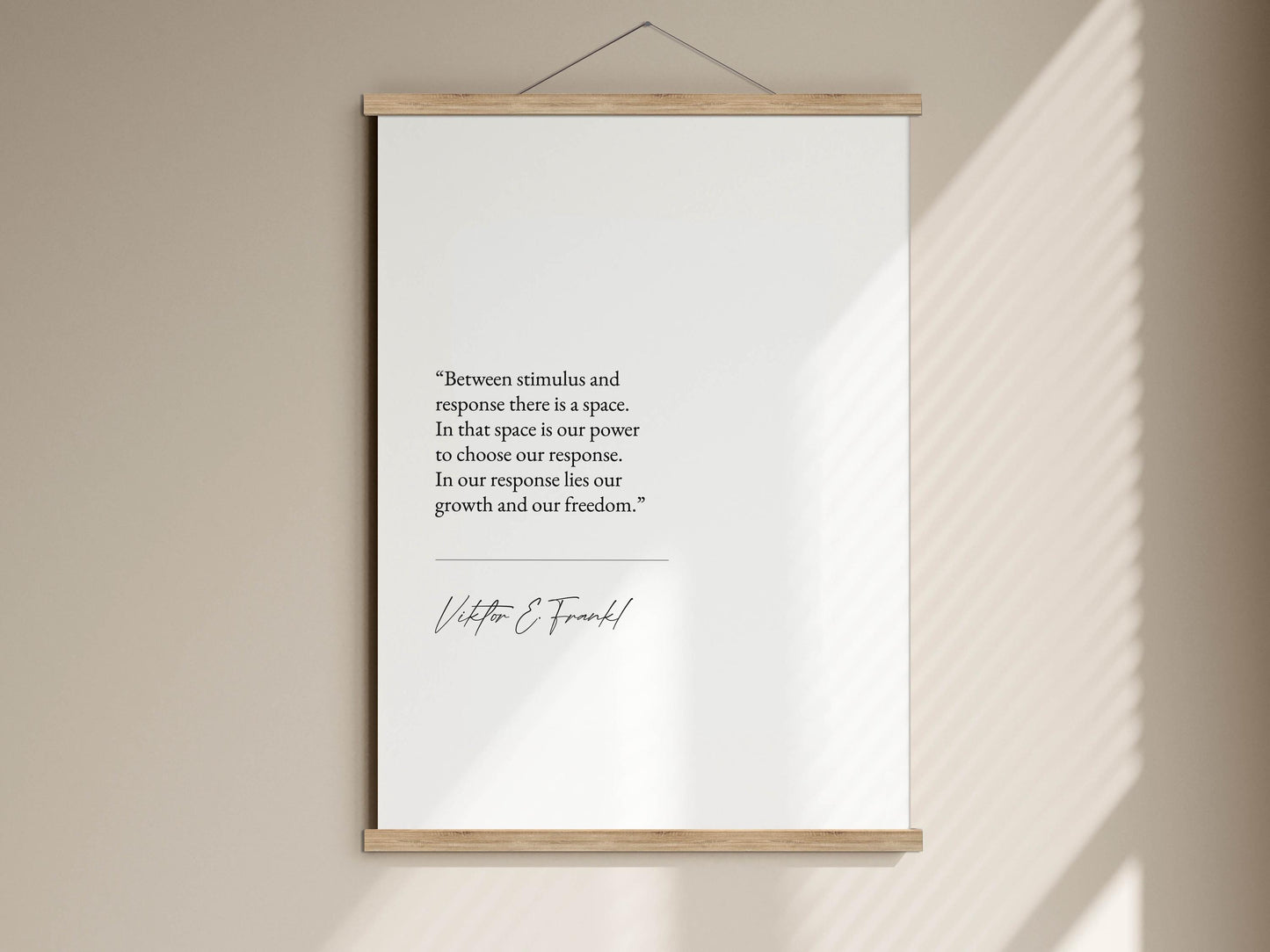 a quote by Vittorio E. Frankl hanging on a wall.