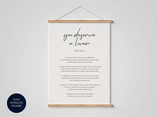 a framed quote by Frida Kahlo, which reads: &quot;You deserve a lover who loves you, who supports you, who listens to you, who respects you, who loves you and doesn&#39;t hate you, who feeds you and doesn&#39;t abuse you.&quot;