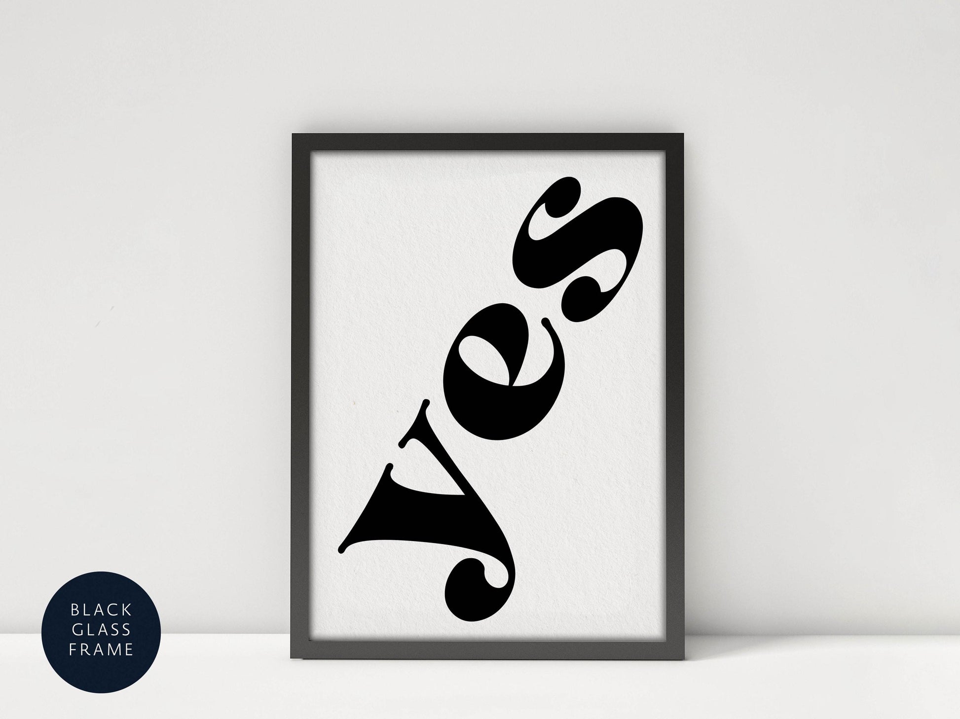 a framed poster with the word &quot;YES&quot; written in a stylized, modern font.