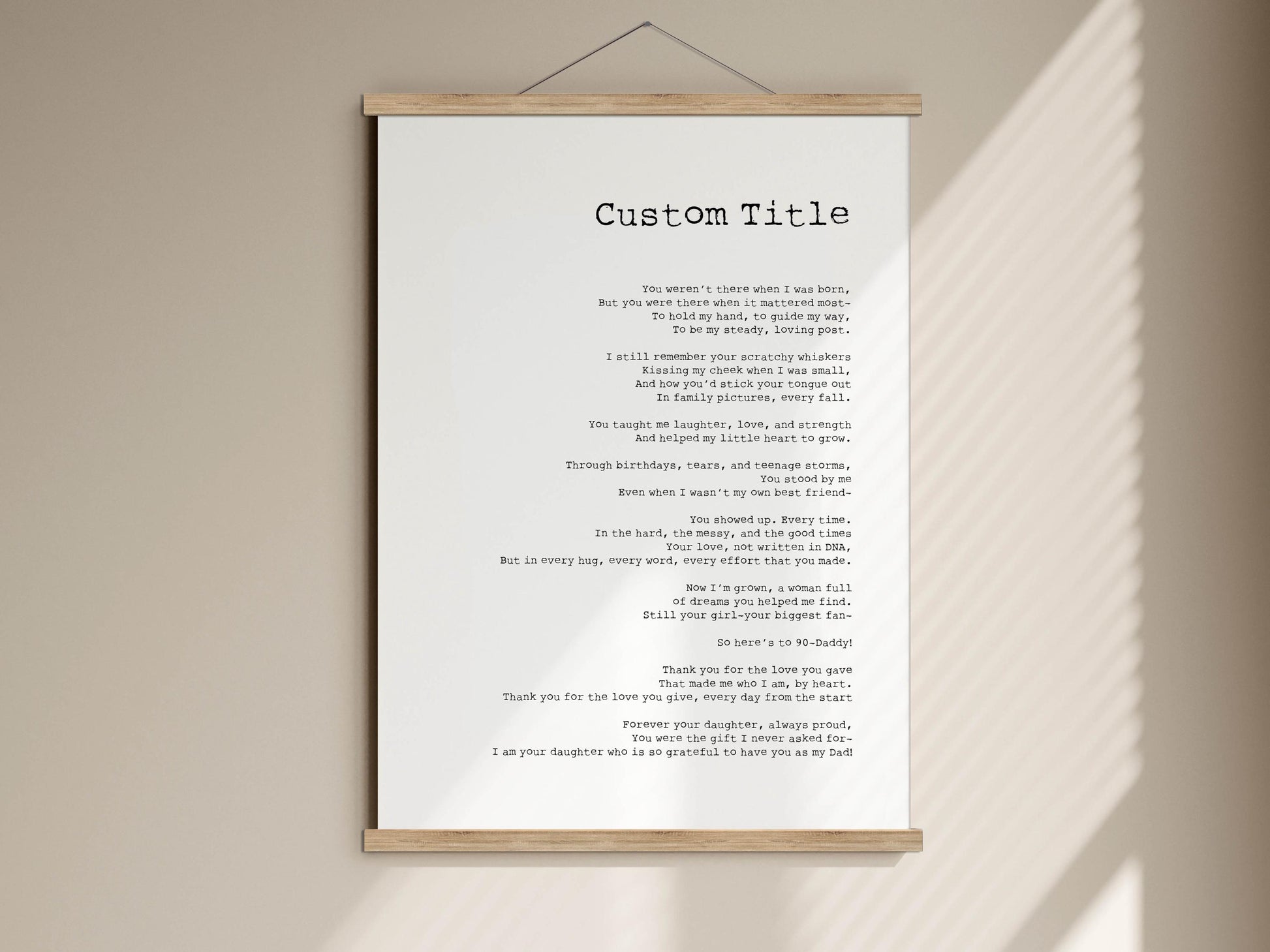 The image is a white poster with a custom title, which appears to be a poem or a song lyrics. The poster is hanging on a wall, and the text is written in black ink. The poster is not a collage of multiple images, and it does not contain any additional text that would describe each individual image. The focus of the image is on the white poster with the black text.