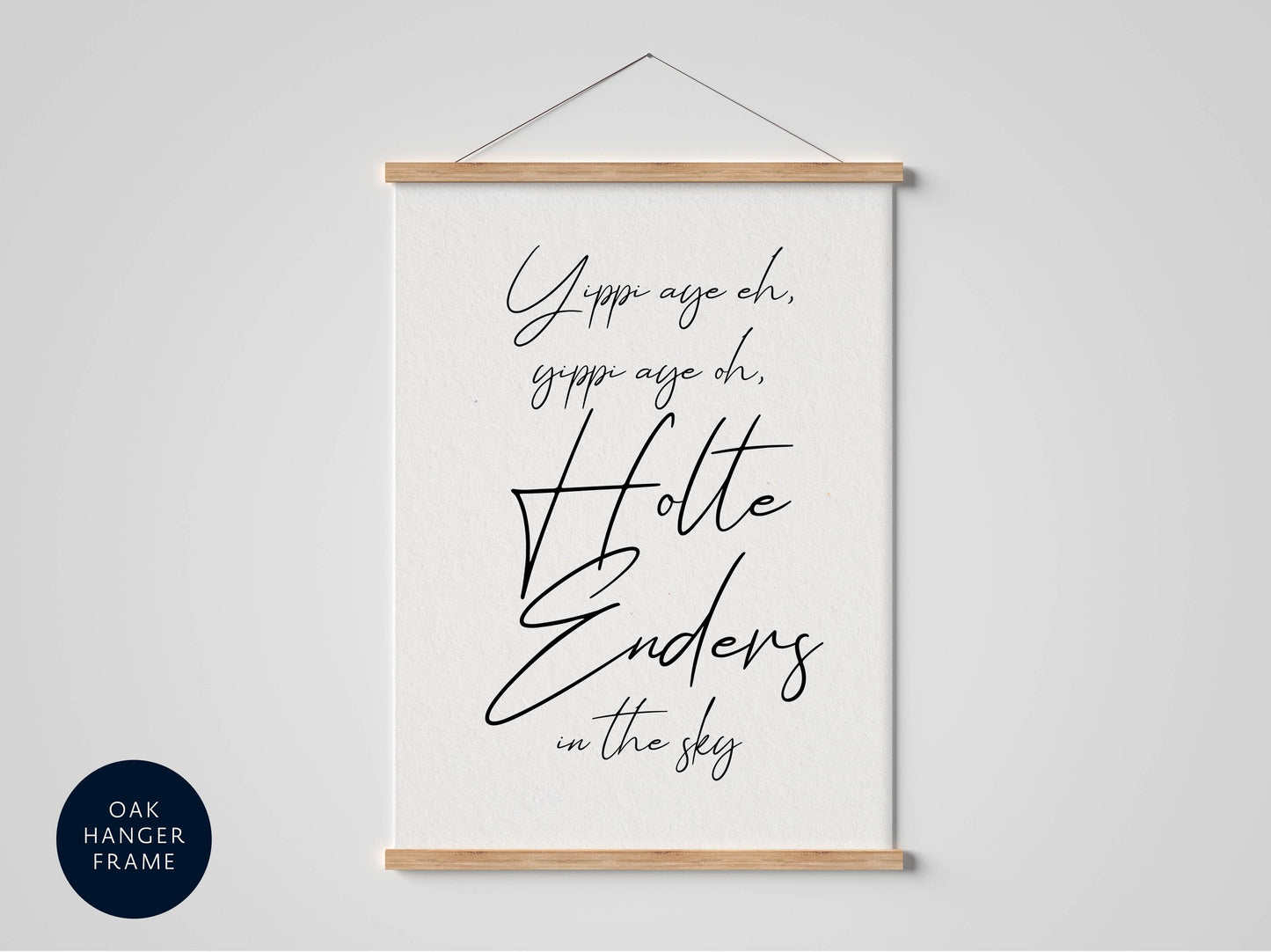 a white poster with black text that reads &quot;Yippee age oh, gippee age oh, Holle Enders in the sky&quot; hanging on a wall.