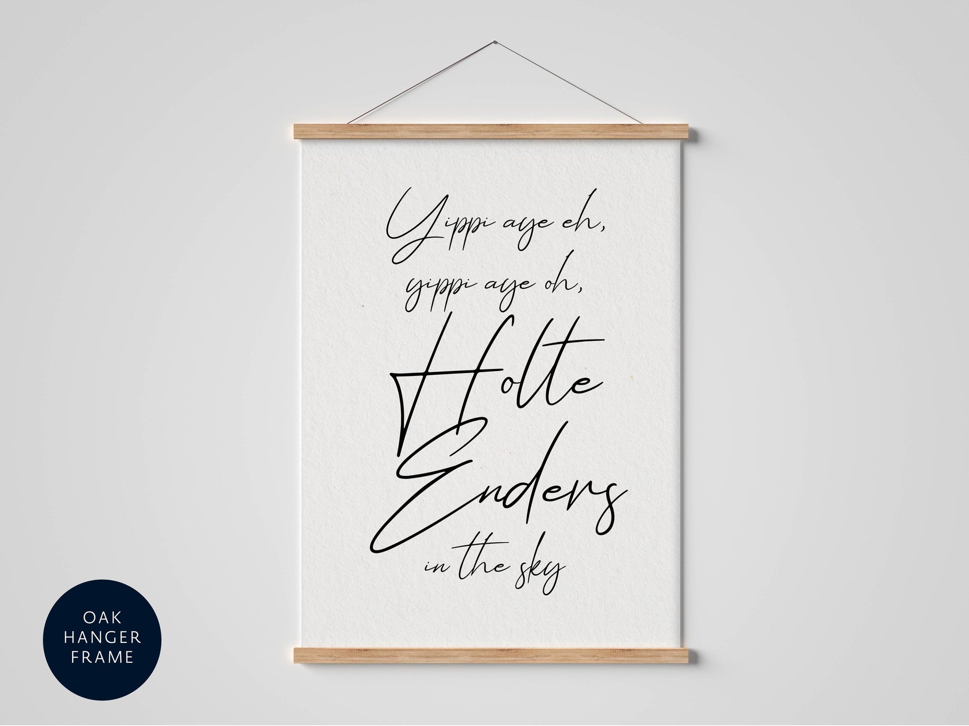 a white poster with black text that reads &quot;Yippee age oh, gippee age oh, Holle Enders in the sky&quot; hanging on a wall.