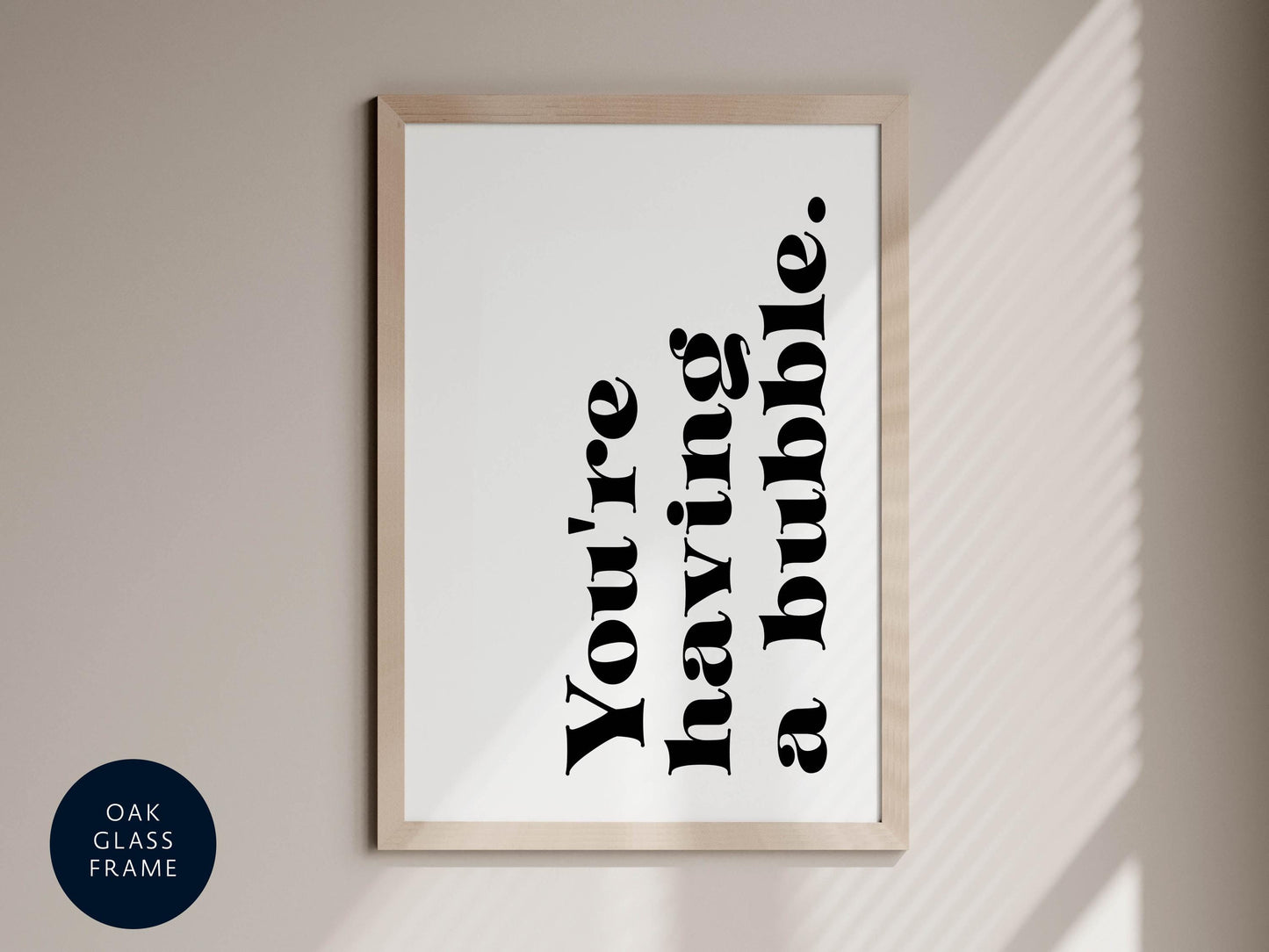a framed print with the text &quot;You&#39;re having a bubble&quot; in a bold, black font.