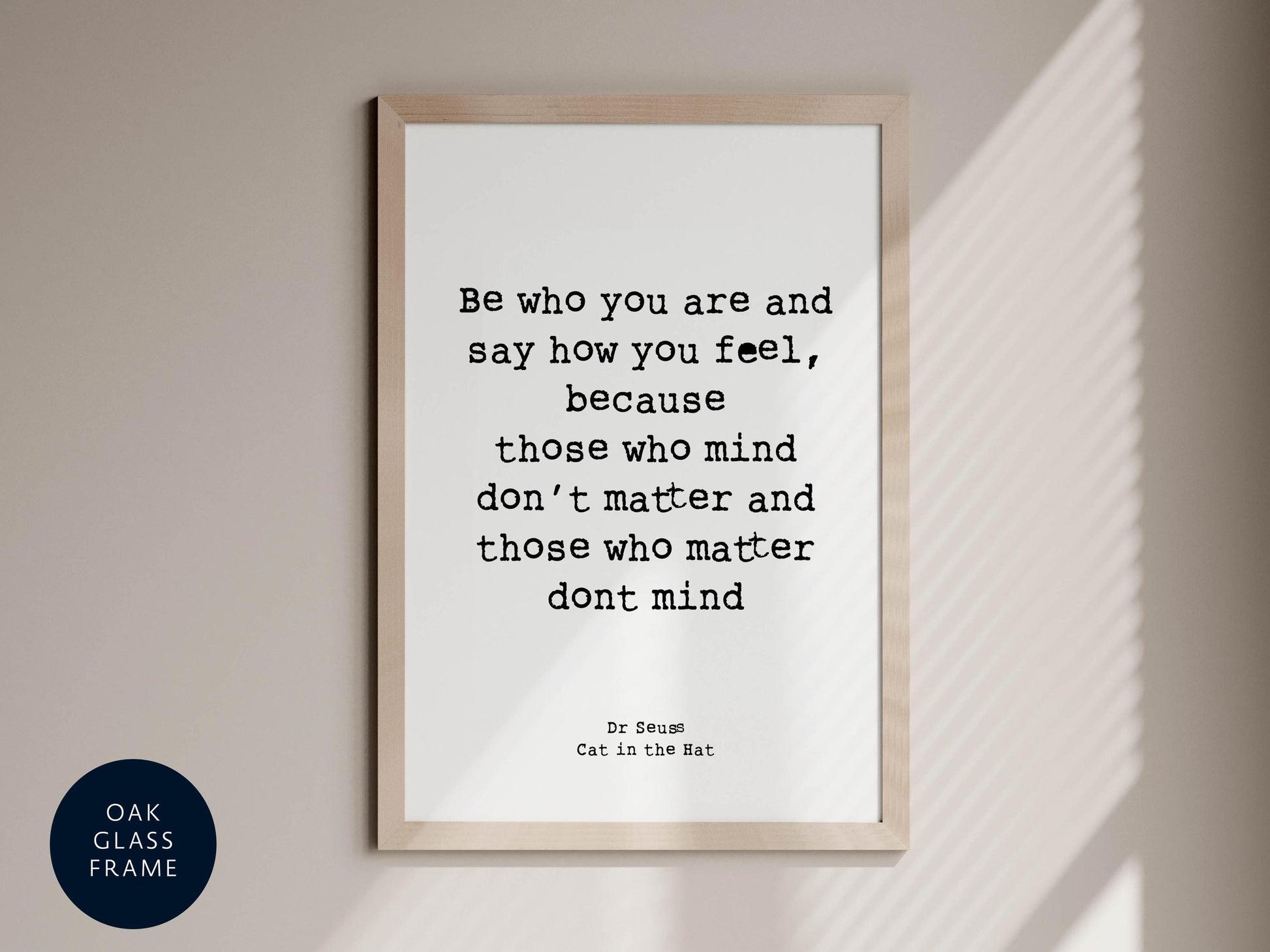 a framed quote by Dr. Seuss, &quot;Cat in the Hat&quot;, which is displayed on a wall.