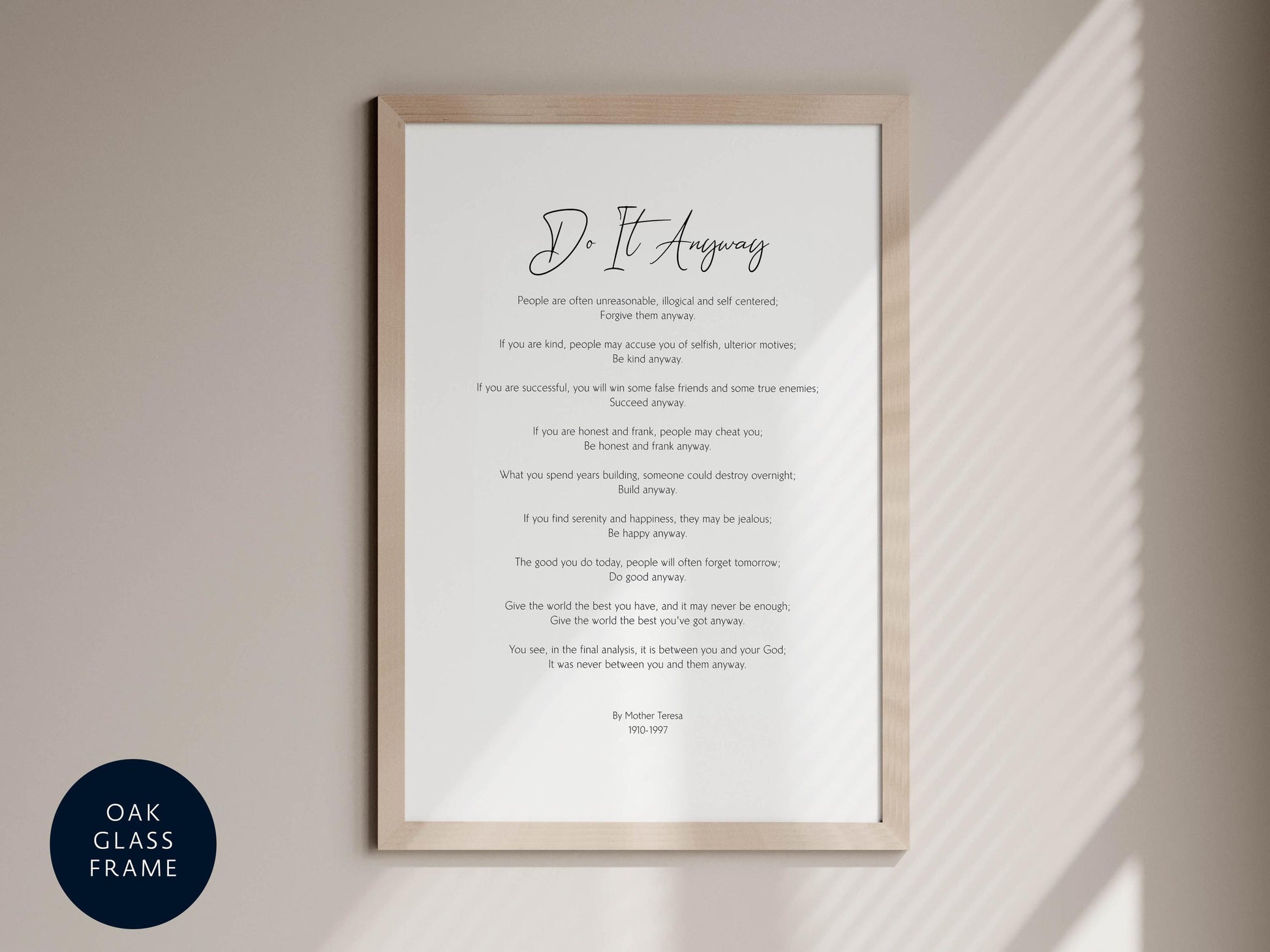 a framed text that reads &quot;Do it anyway&quot; in a black and white style.