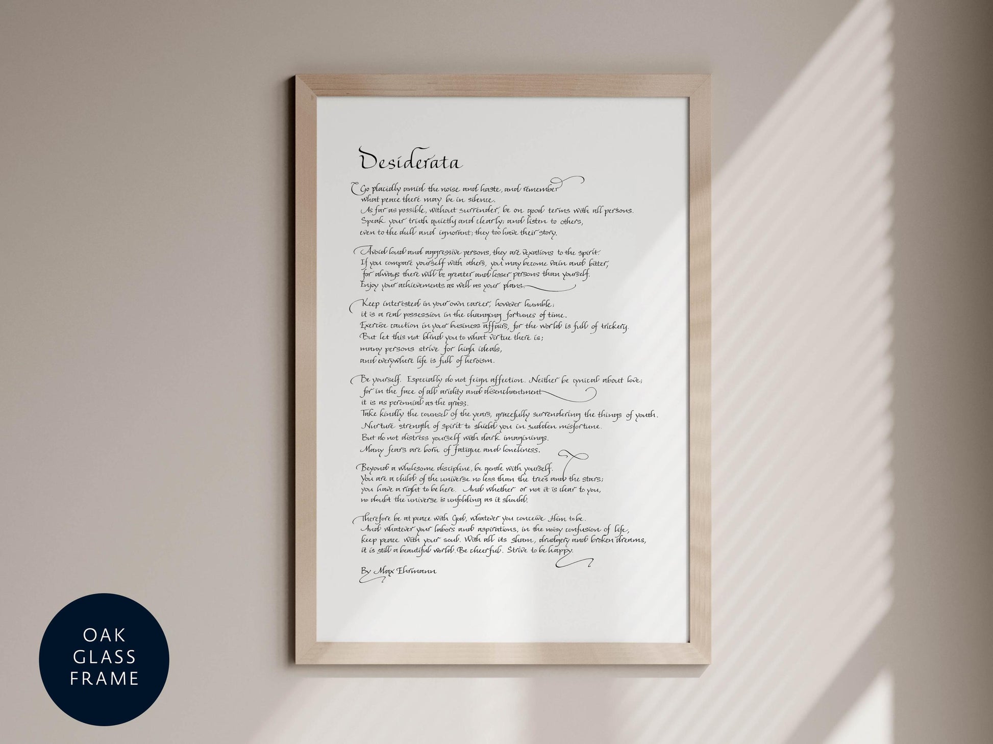 a framed print of a poem titled &quot;Desireata&quot; by Mary Elizabeth Bronson, with a black and white color scheme.