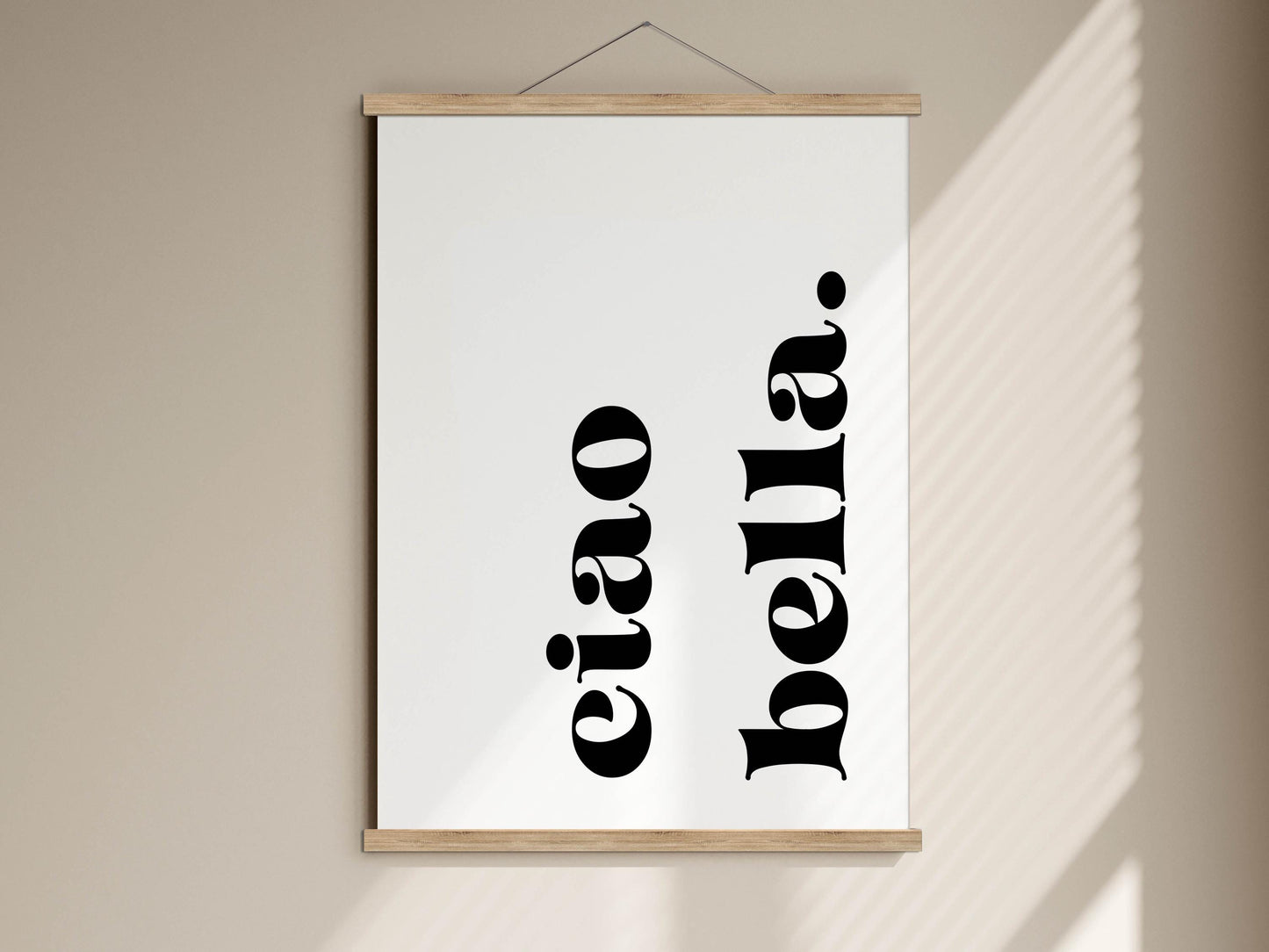 a white poster with black text that reads &quot;eiao&quot; and &quot;bella&quot;.