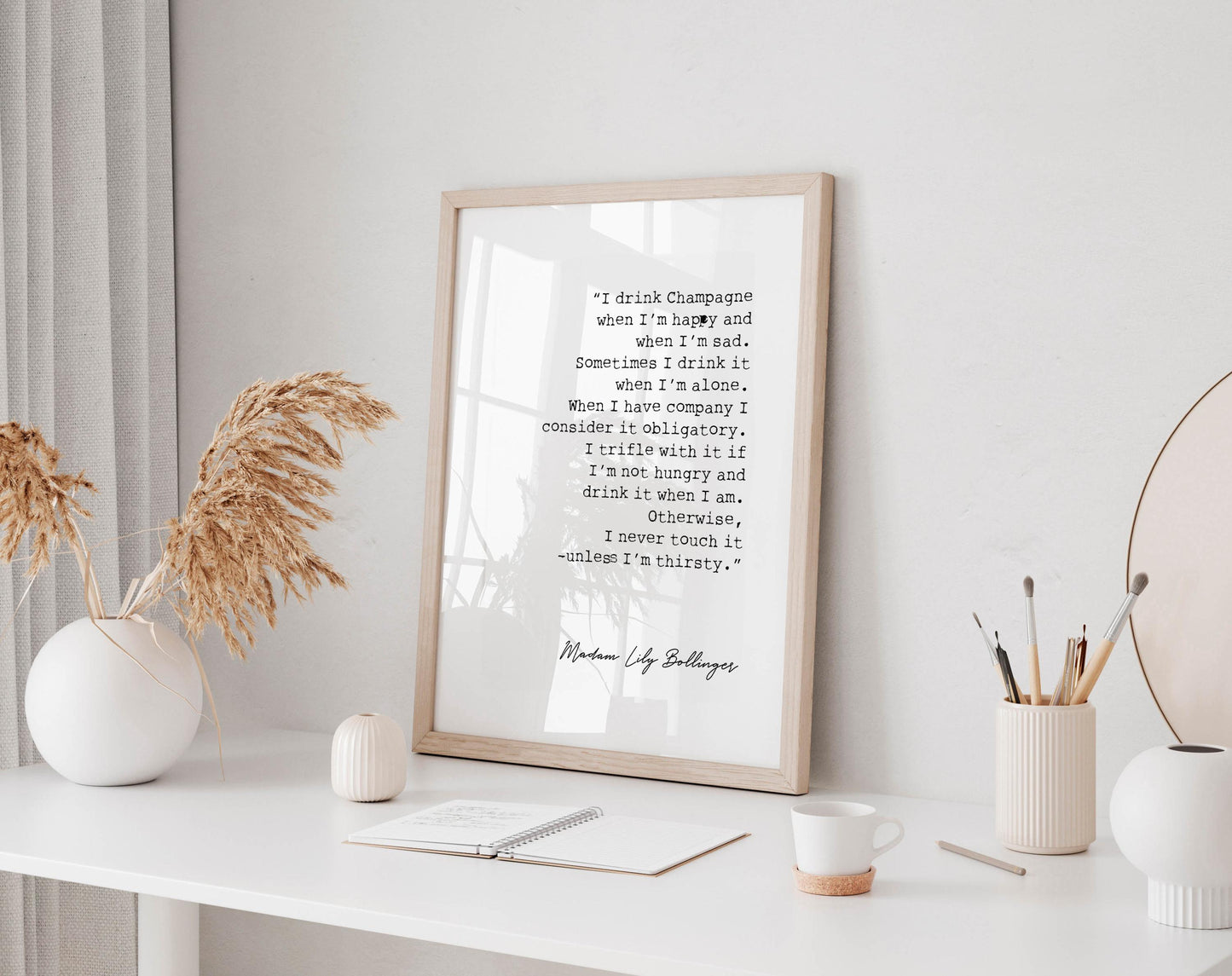 a framed quote by Munch by Lloyd Bollinger, which reads: &quot;I think champagne and when I&#39;m sad. Sometimes I think I&#39;m alone. When I&#39;m alone, I consider it acceptable. I drink it if I&#39;m happy and if I&#39;m sad. I drink it when I&#39;m hungry and when I&#39;m thirsty. I never drink it when I&#39;m tired.&quot;