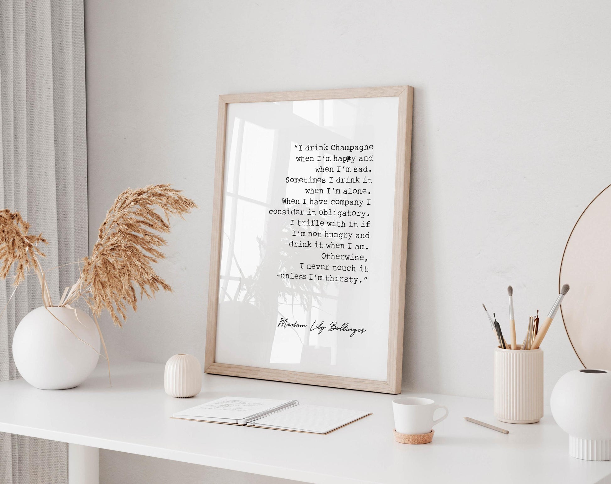 a framed quote by Munch by Lloyd Bollinger, which reads: &quot;I think champagne and when I&#39;m sad. Sometimes I think I&#39;m alone. When I&#39;m alone, I consider it acceptable. I drink it if I&#39;m happy and if I&#39;m sad. I drink it when I&#39;m hungry and when I&#39;m thirsty. I never drink it when I&#39;m tired.&quot;