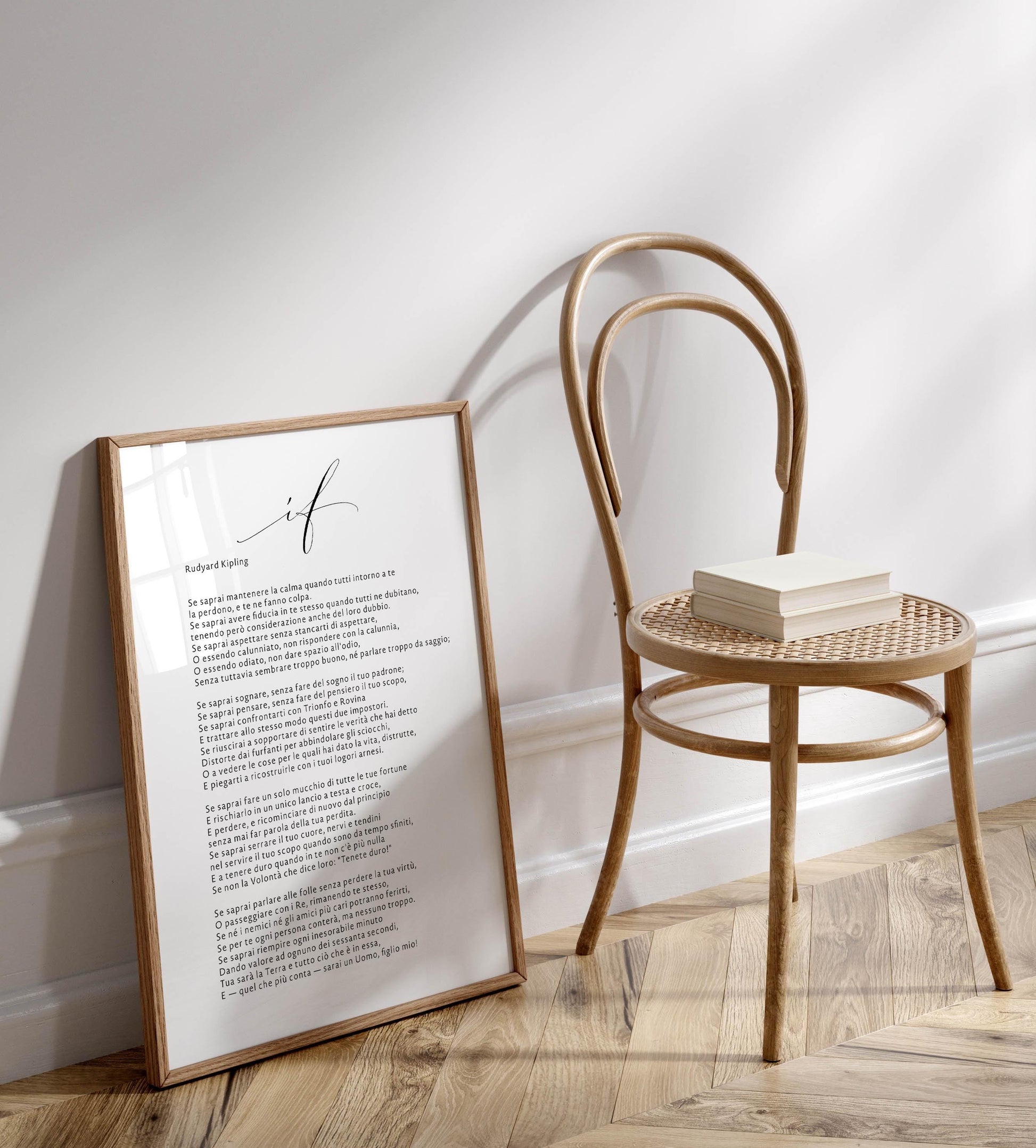 a wooden chair with a book resting on it, positioned next to a framed text that appears to be a poem or a list of words.