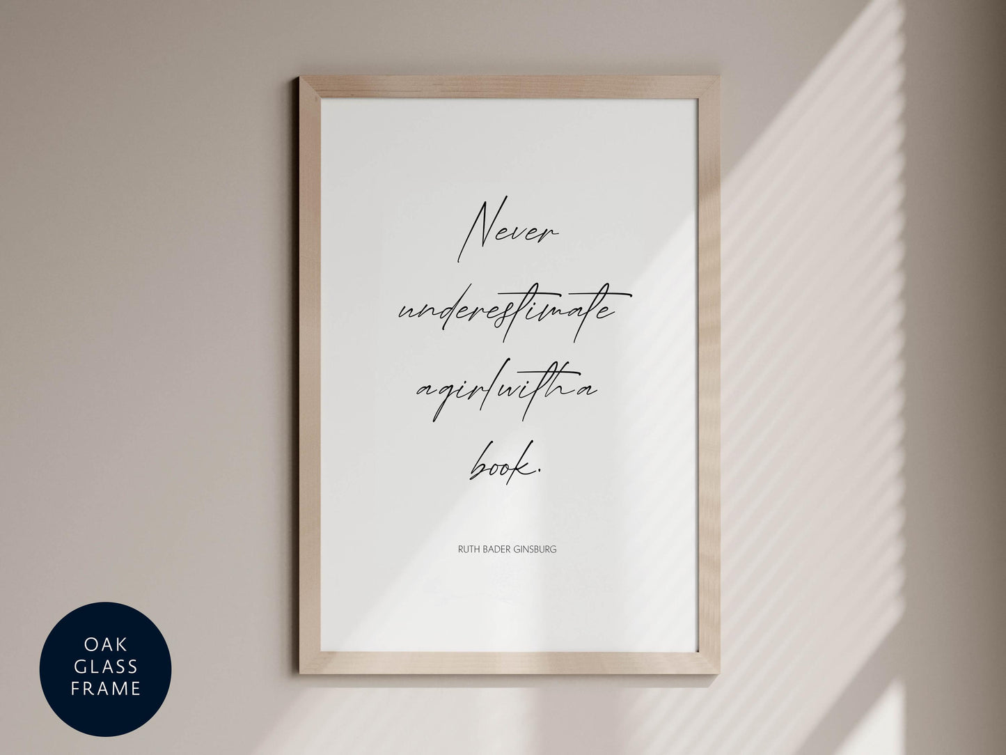 a framed quote by Ruth Bader Ginsburg that reads &quot;Never underestimate again with a book&quot;.