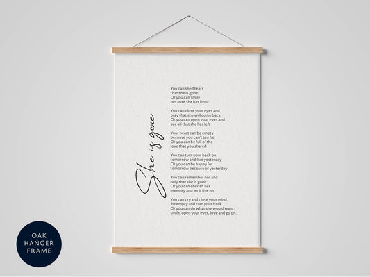 a framed poem titled &quot;She is gone&quot; by an author. The poem is written in a cursive font and is displayed on a white background. The poem is a tribute to the author&#39;s late husband, who passed away recently. The poem expresses the author&#39;s feelings of loss and longing for their late husband. The poem is a heartfelt tribute to the author&#39;s love and memories of their husband.