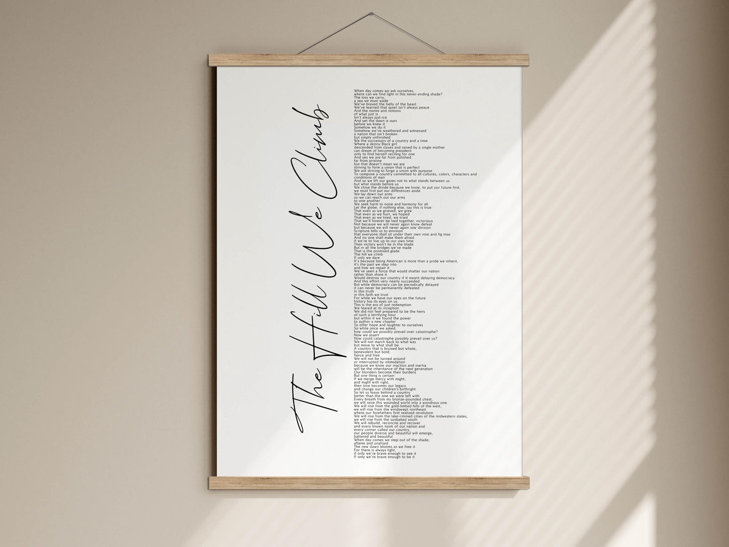 The image is a poster hanging on a wall, featuring a list of words in a cursive font.
