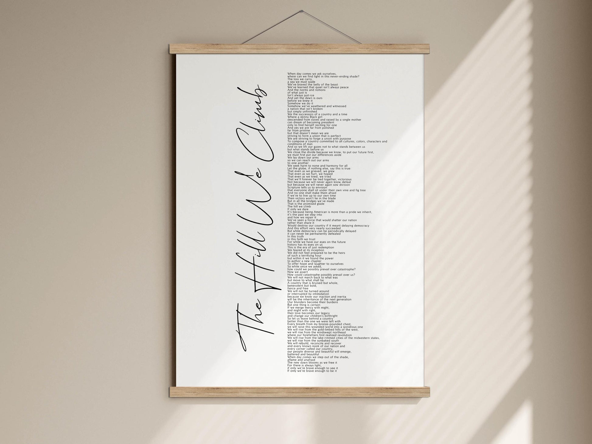 The image is a poster hanging on a wall, featuring a list of words in a cursive font.