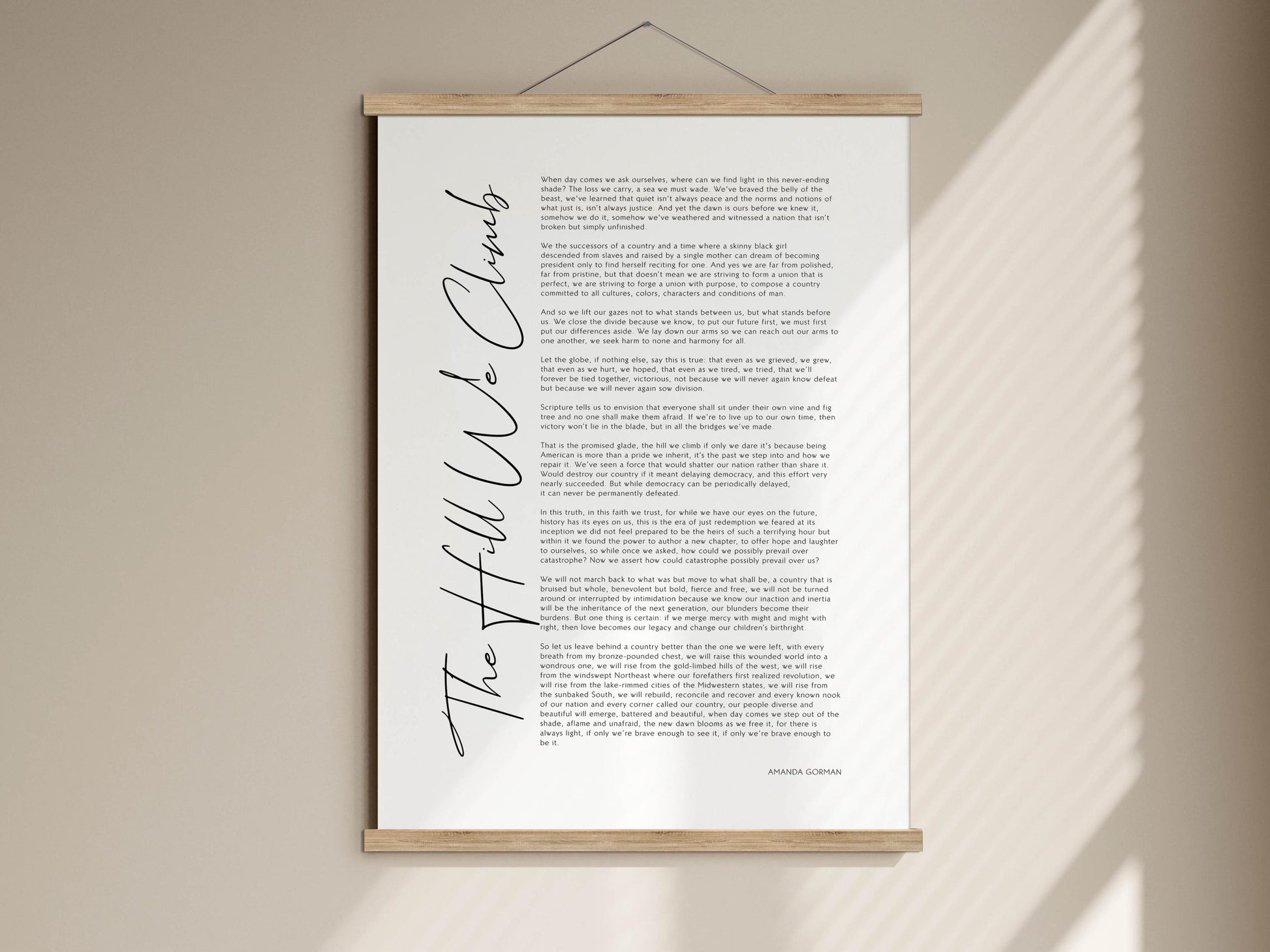 The image is a poster with a text that is too long to describe in detail. It is hanging on a wall and appears to be a piece of art or a printed document.