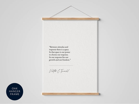 a quote by Viktor Frankl hanging on a wall, which reads: &quot;Between stimulus and response there is a space. In that space is our power. In our response lies our growth and our freedom.&quot;