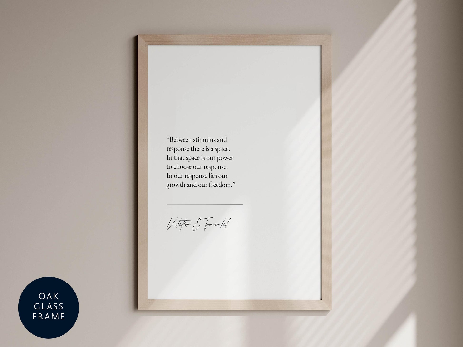 a quote by Viktor Frankl, which reads: &quot;Between stimulus and response there is a space. In that space is our power to choose our response. In our response lies our growth and our freedom.&quot; The quote is presented in a black and white format, and it is framed within a wooden frame. The image also includes a small logo in the bottom left corner that says &quot;OAK CLASS FRAME&quot;.