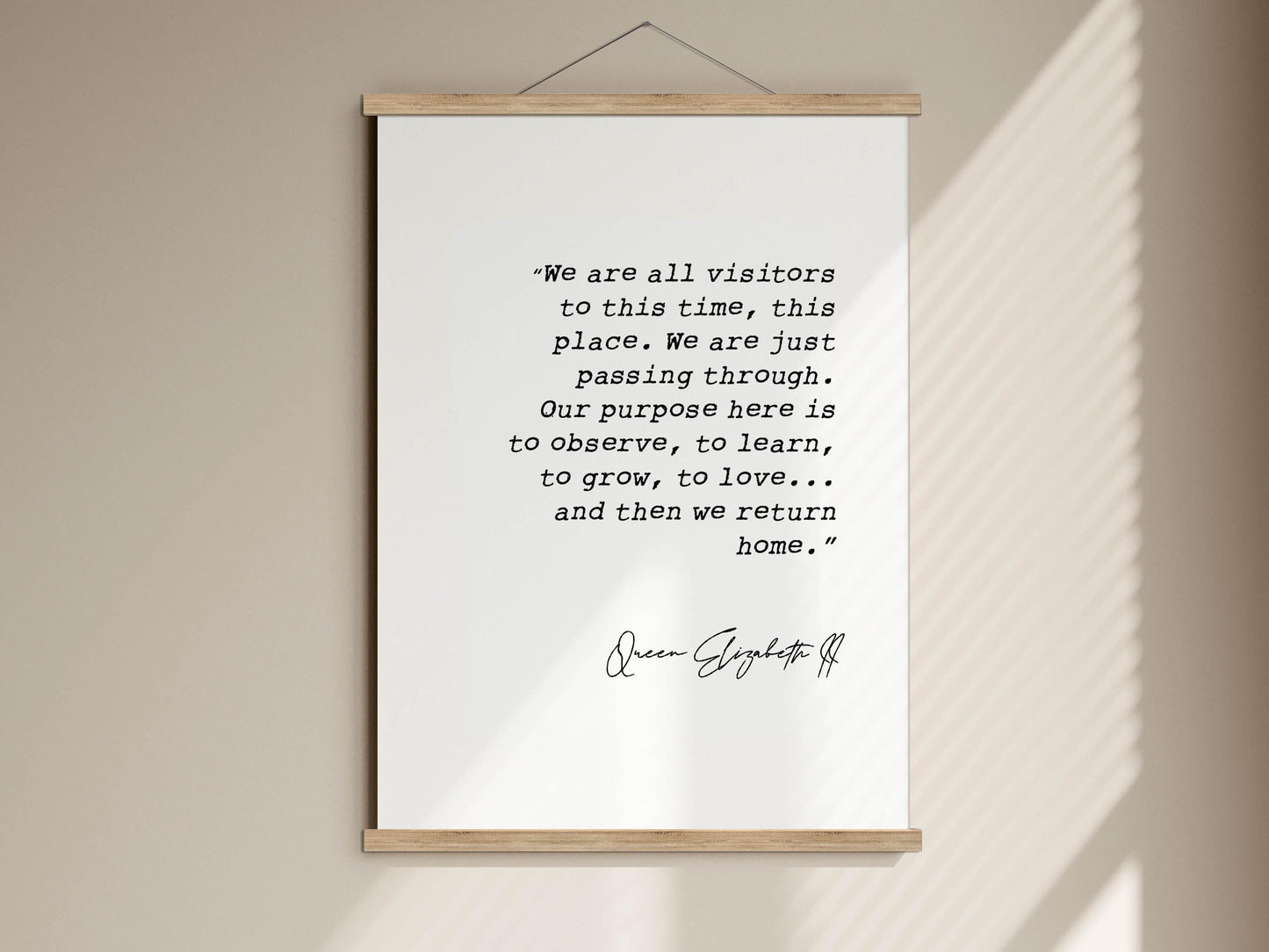 a quote by Queen Elizabeth II hanging on a wall.