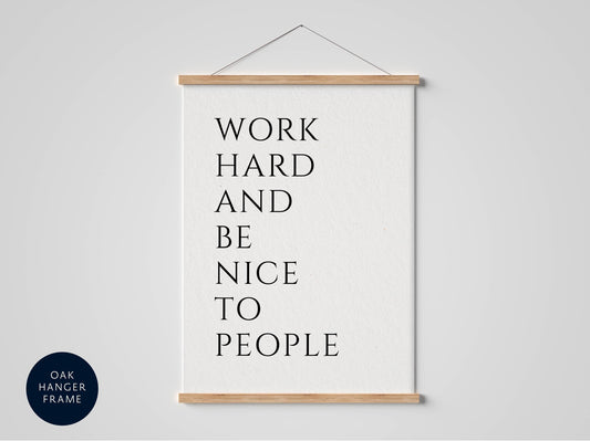a white poster with black text that reads &quot;WORK HARD AND BE NICE TO PEOPLE&quot;.