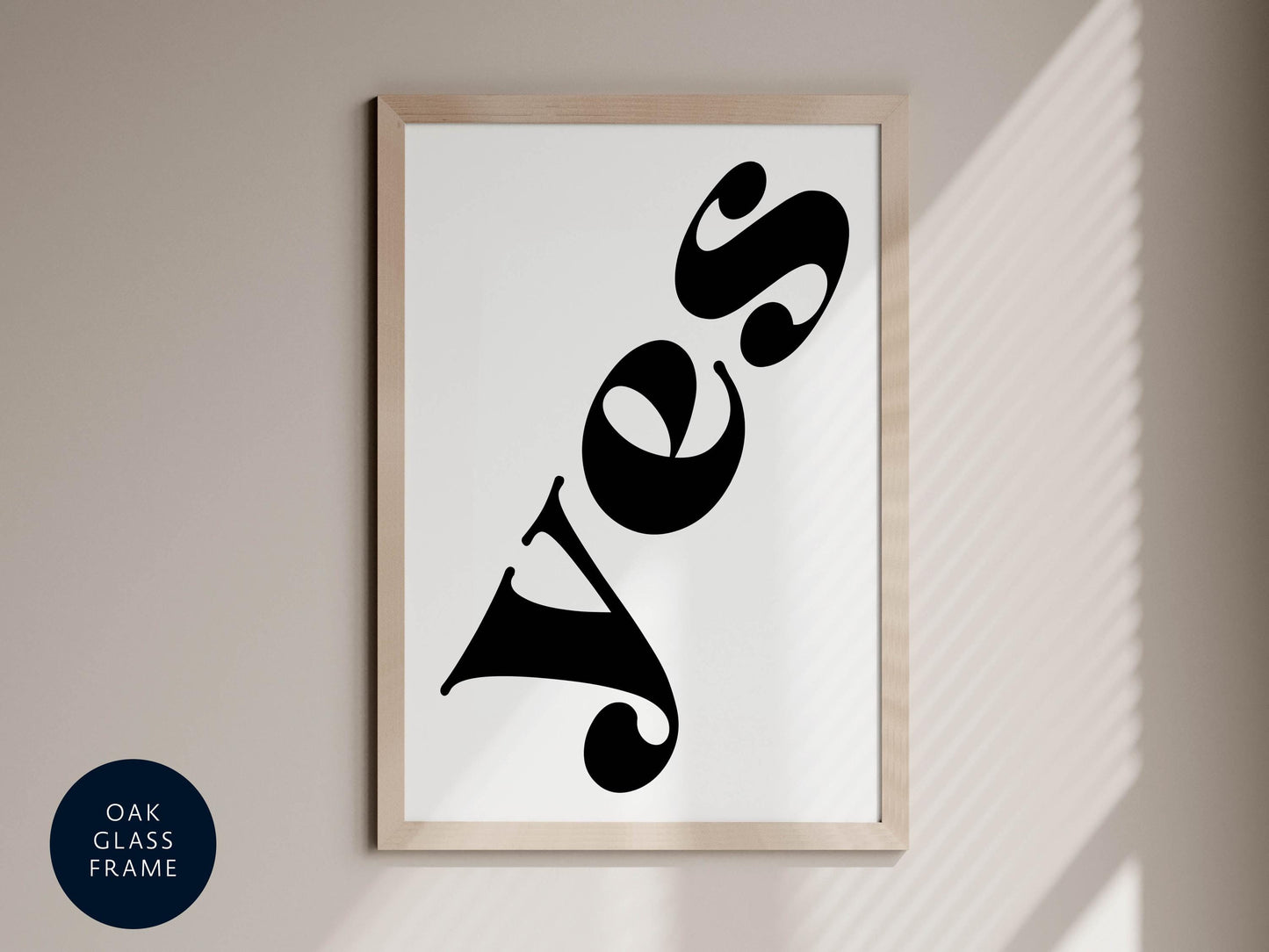 a framed poster with the word &quot;YES&quot; written in a stylized, modern font.