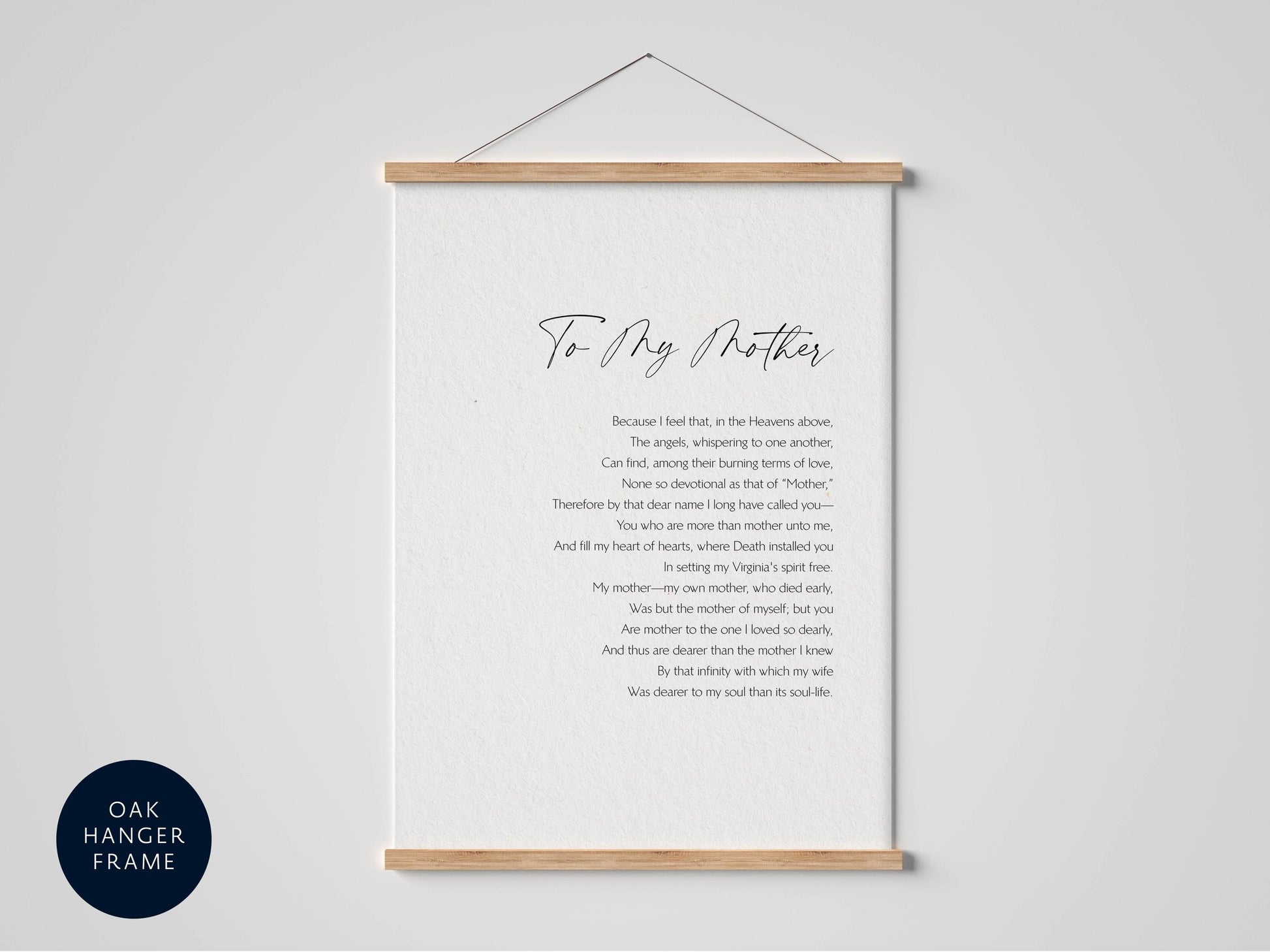 a framed print with a poem titled "To My Mother" written in cursive. The poem is about the love and bond between a mother and her child, expressing feelings of love, loss, and the passage of time. The poem is presented in a black and white color scheme, with the title and poem text written in a cursive font. The frame is hanging on a wall, and the text is centered within the frame.
