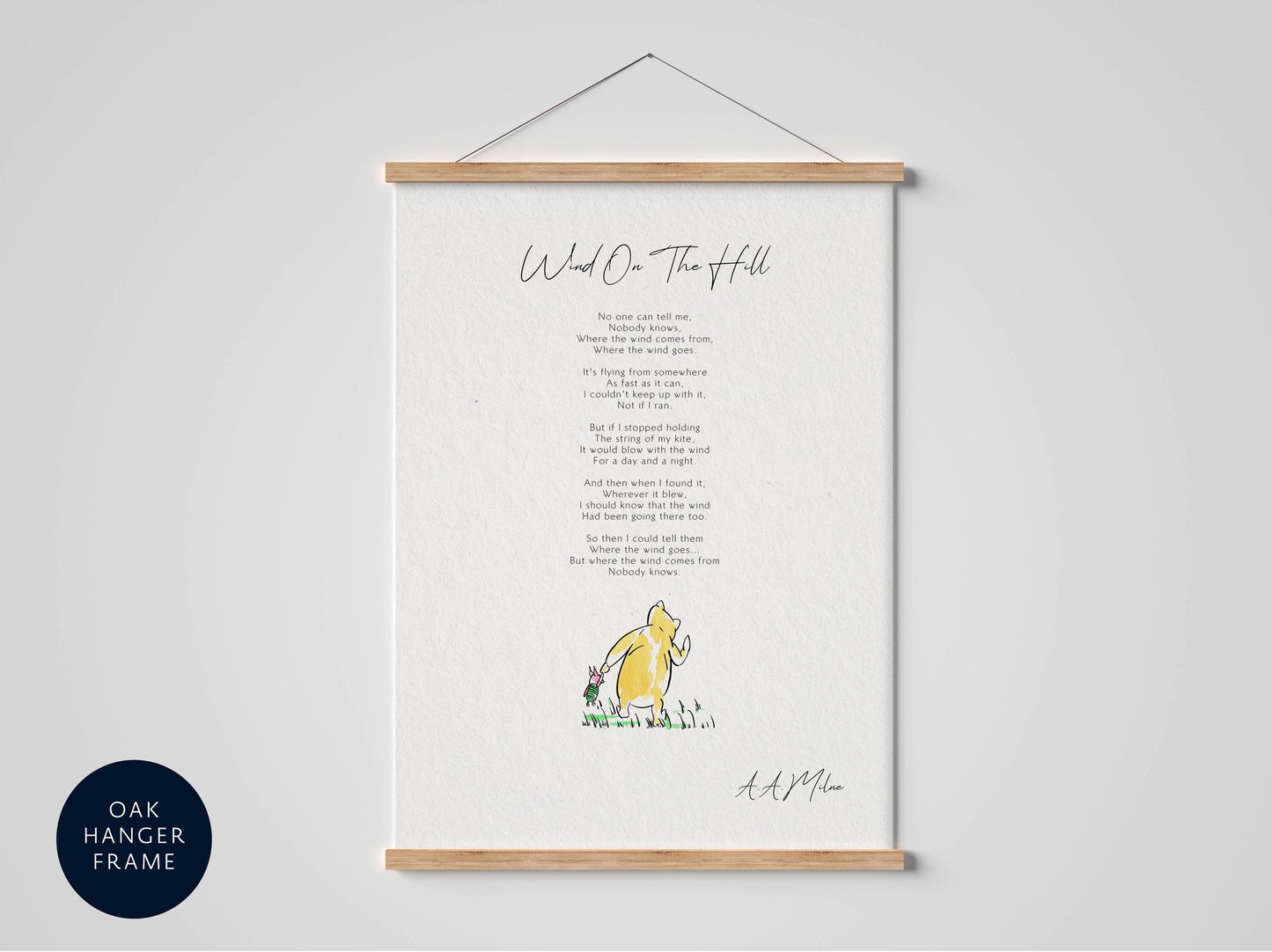 a framed poster with a poem titled "Wind O' the Hill" by A. A. Milne.