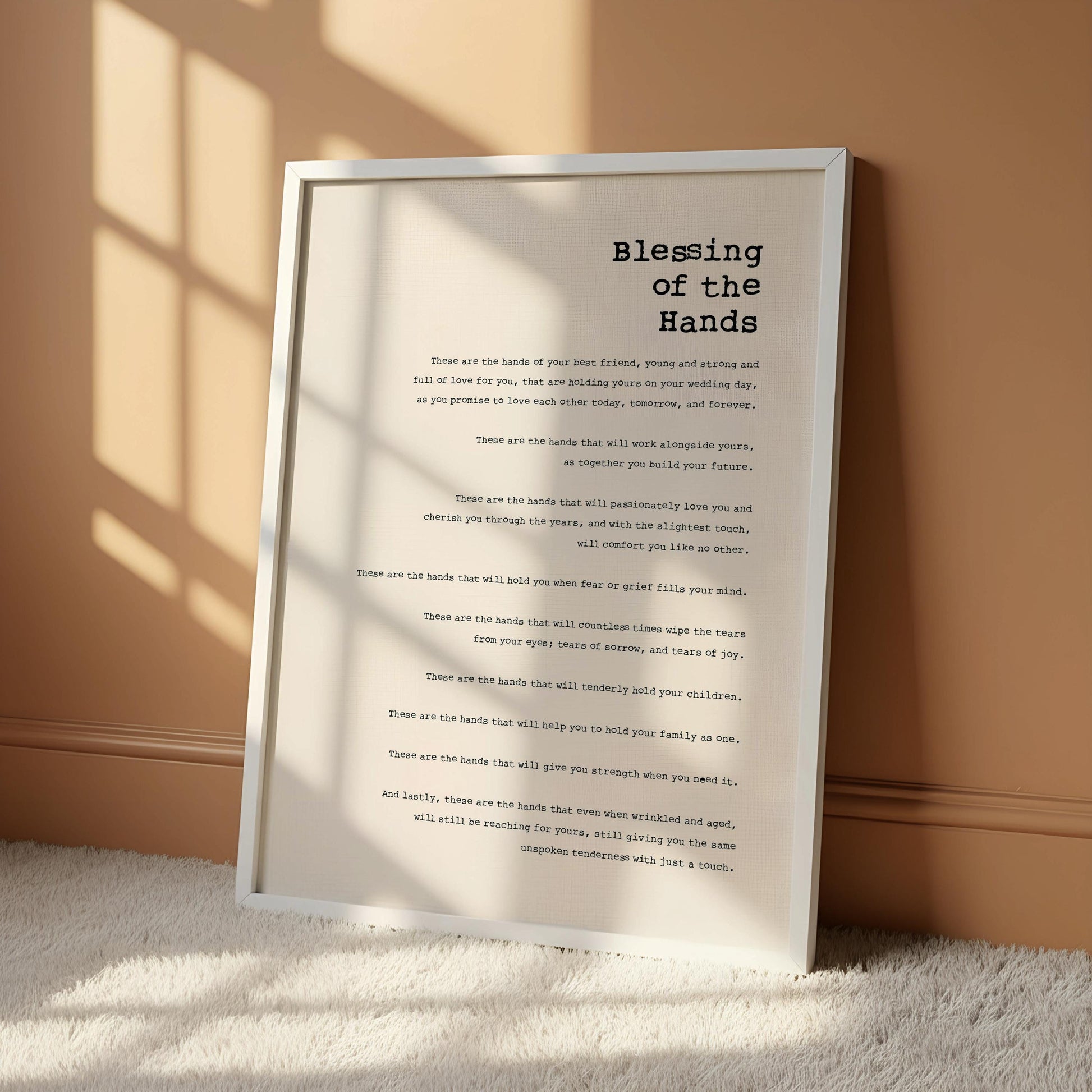 The image is a framed print with a poem titled "Blessing of the Hands" hanging on a wall.