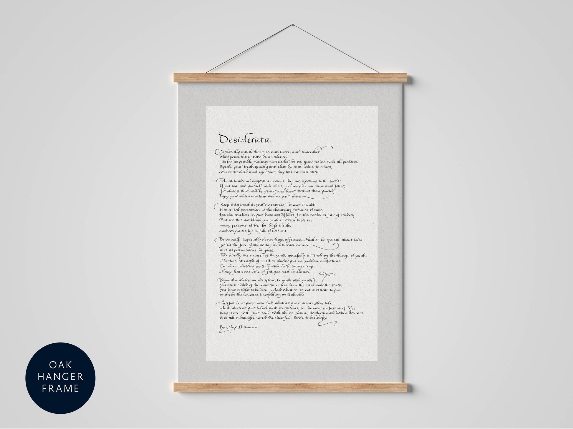 a framed piece of paper with handwritten text on it, which appears to be a poem or a song lyrics.