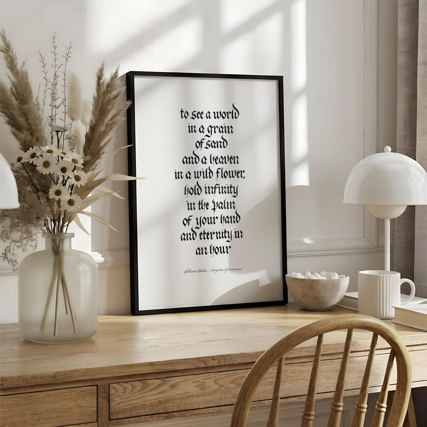 a quote in a foreign language, which is a quote by William Blake about seeing a world in a grain of sand and a leaf in a wild flower, holding infinity in the palm of your hand and eternity in an hour.