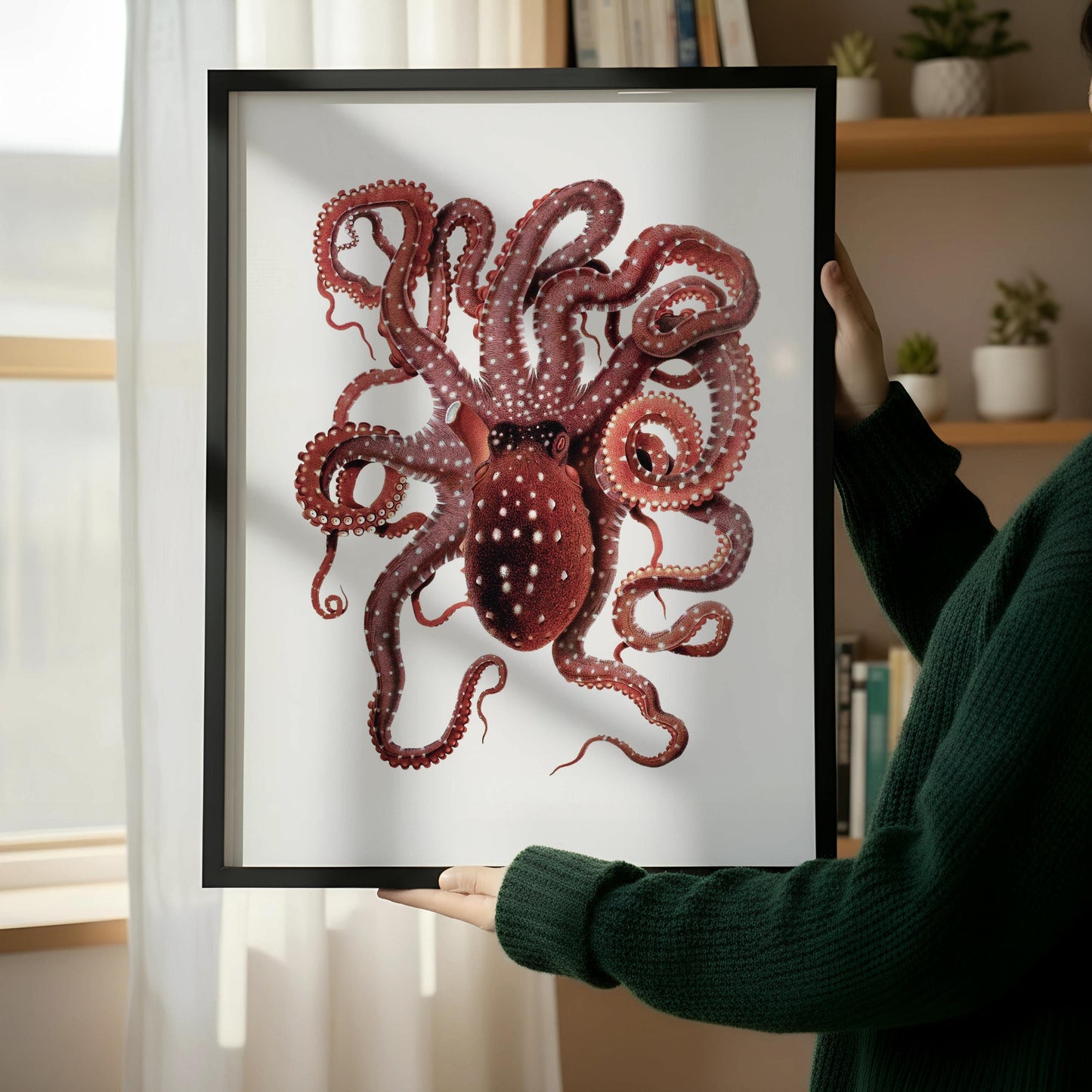 a framed illustration of an octopus, with its tentacles spread out, placed on a wooden floor next to a wooden chair.