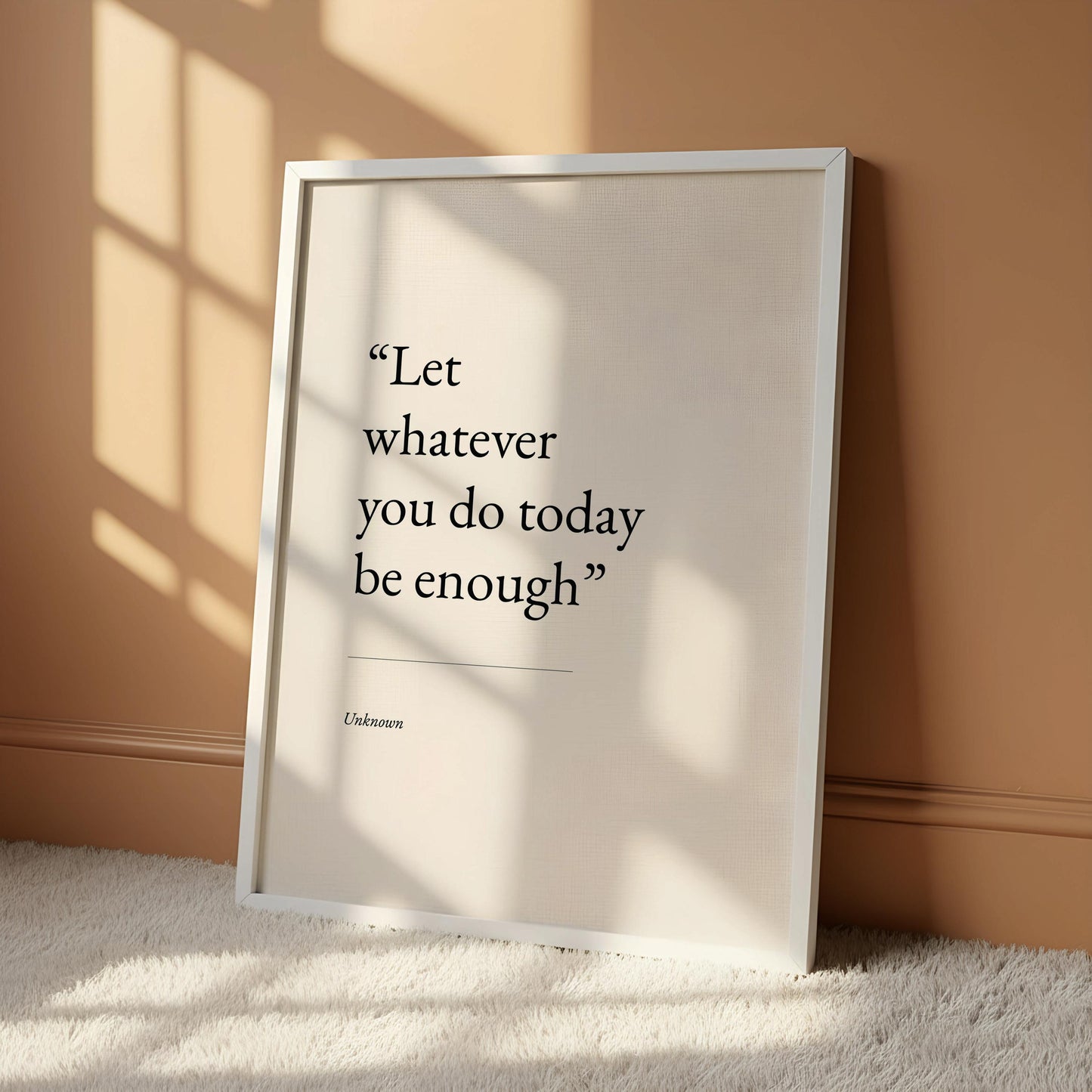 a quote poster hanging on a wall, which reads "Let whatever you do today be enough".
