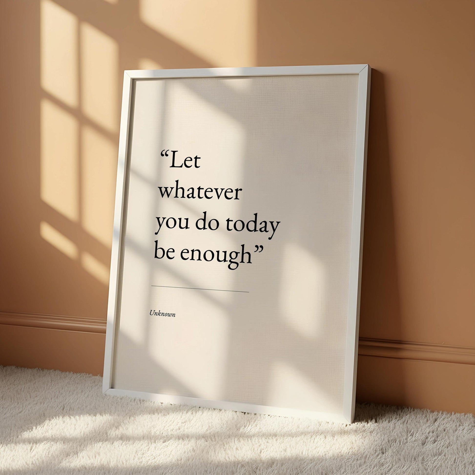 a quote poster hanging on a wall, which reads "Let whatever you do today be enough".