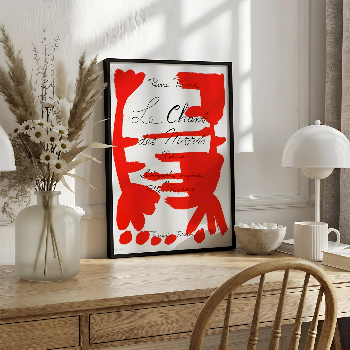 The image is a poster with a large red abstract design and text.