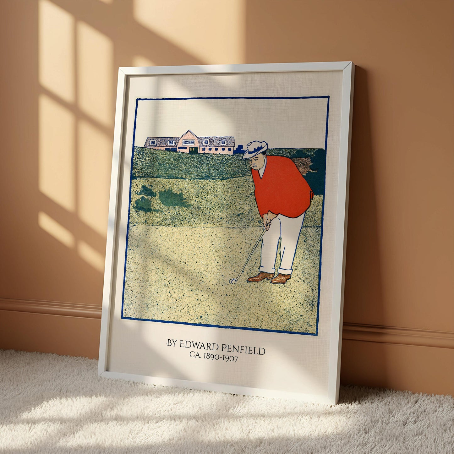 A framed illustration of a man in an orange shirt and white hat playing golf, with a building in the background.