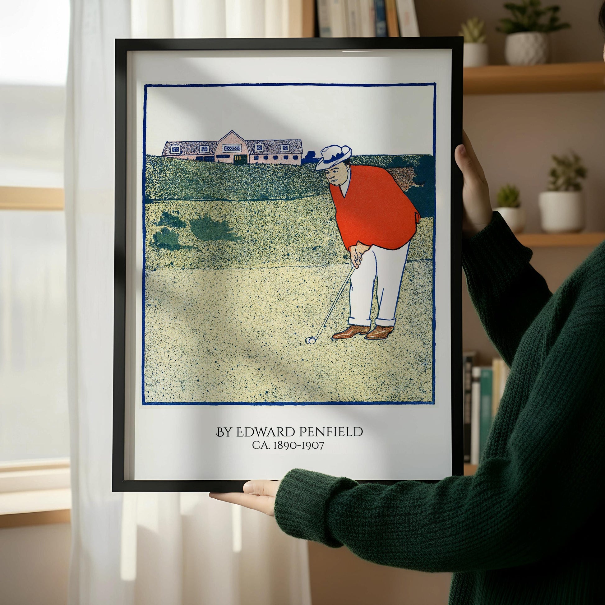 a framed illustration of a golfer on a golf course, with a chair and a book on a wooden floor next to it.
