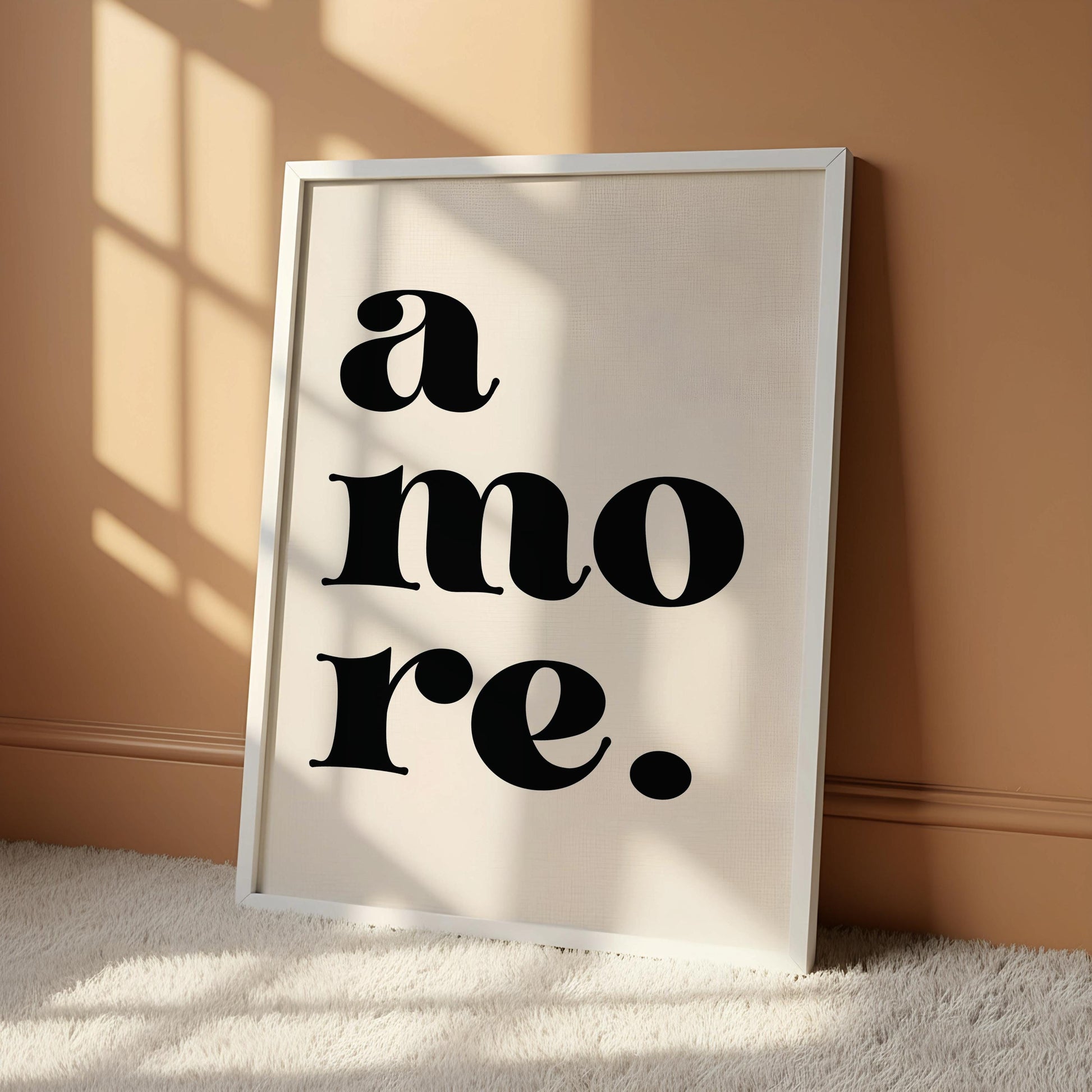 A white poster with the text "a more" in a bold, sans-serif font.