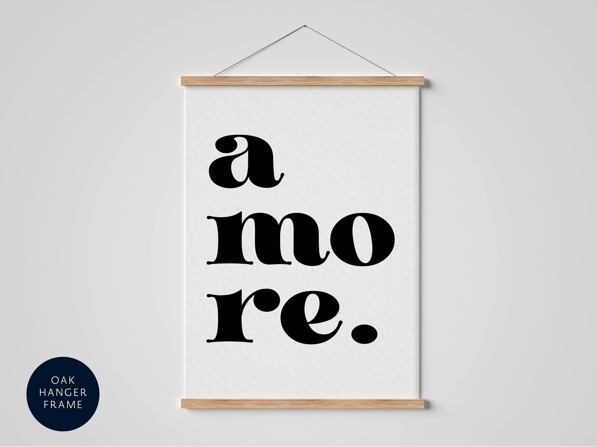 A framed poster with the text "a more." in a bold, sans-serif font.