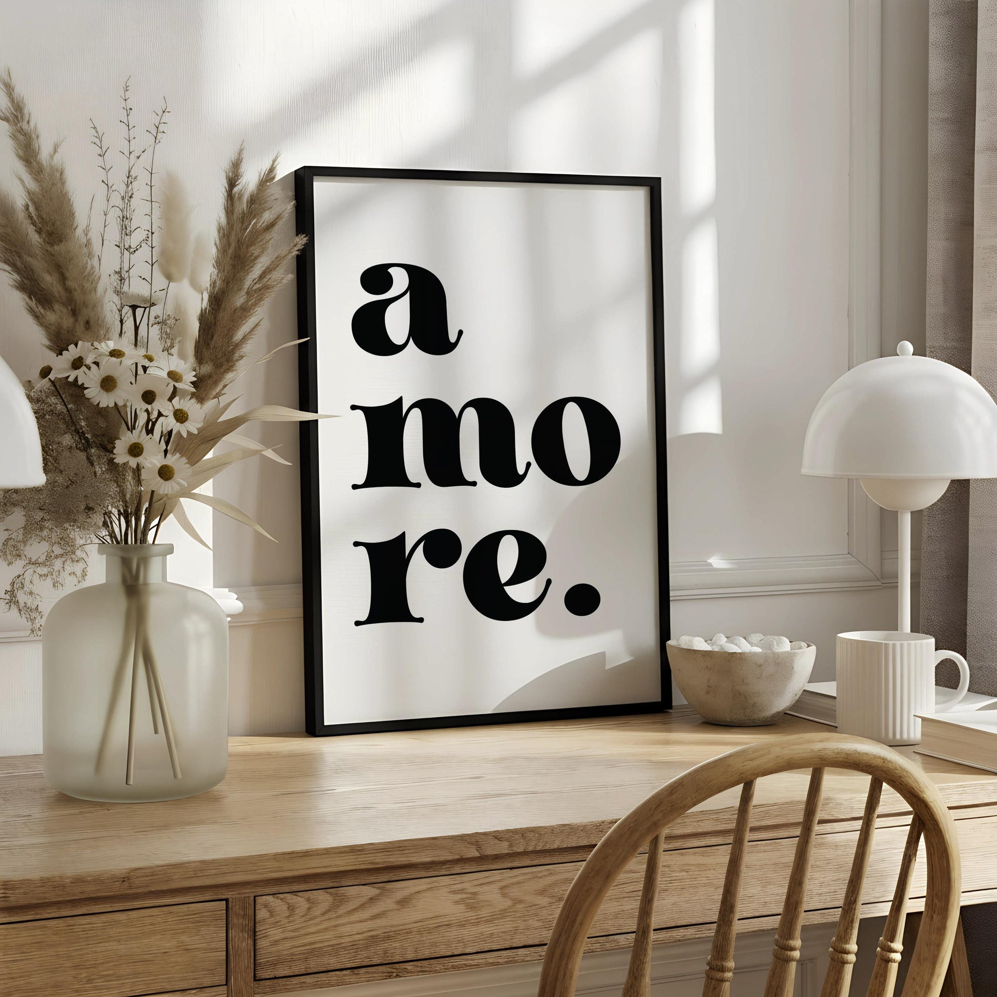 A white poster with the text "a more" in bold black letters.