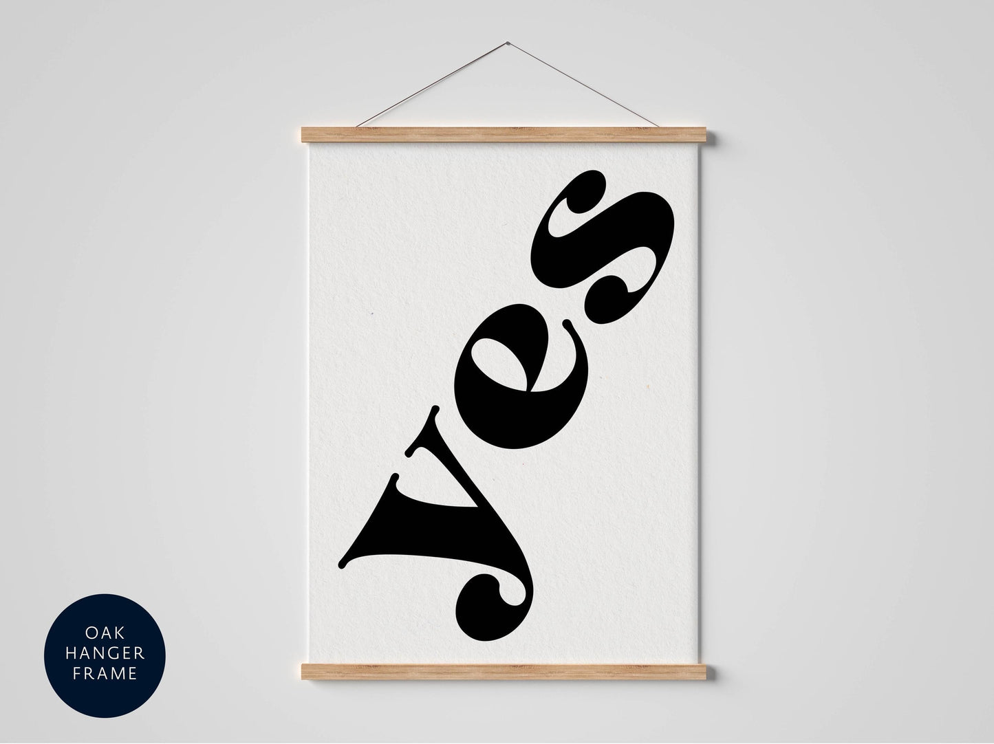 a framed poster with the word "YES" written in a stylized, modern font.