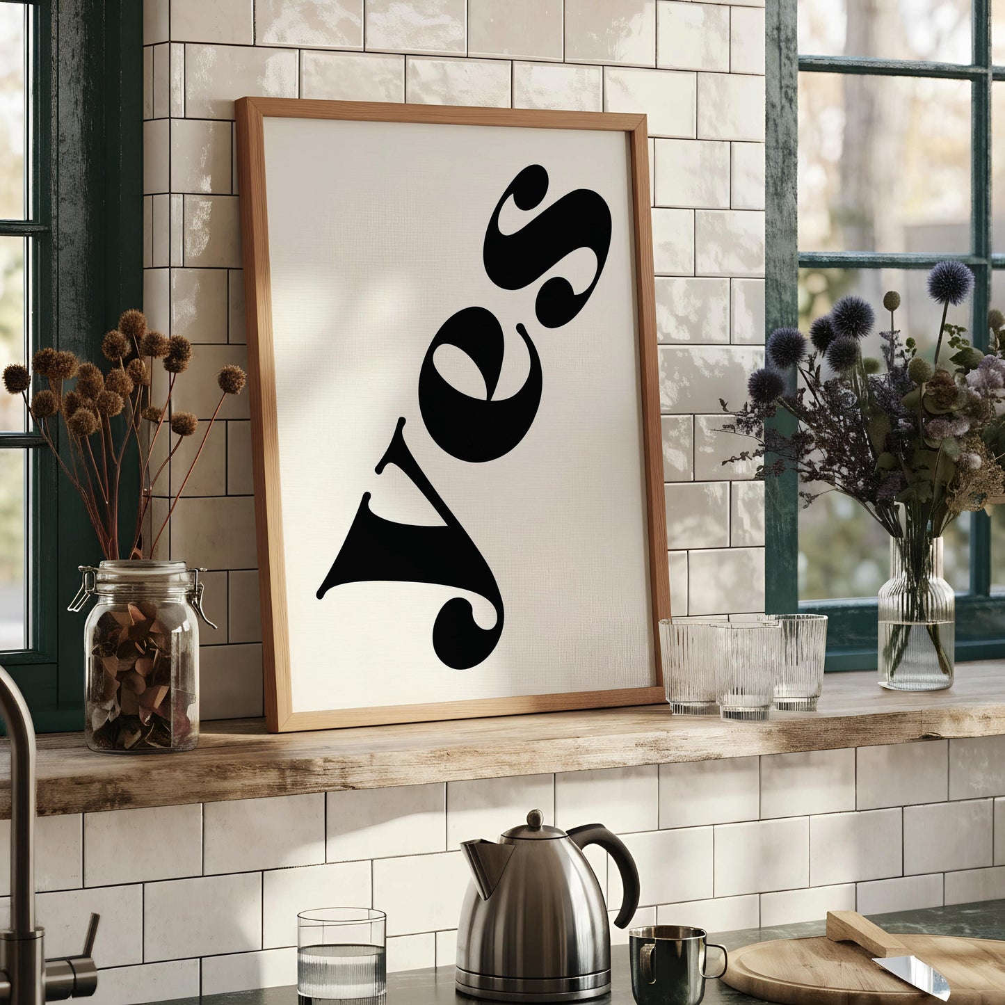 a framed poster with the word "YES" written in a stylized, modern font.