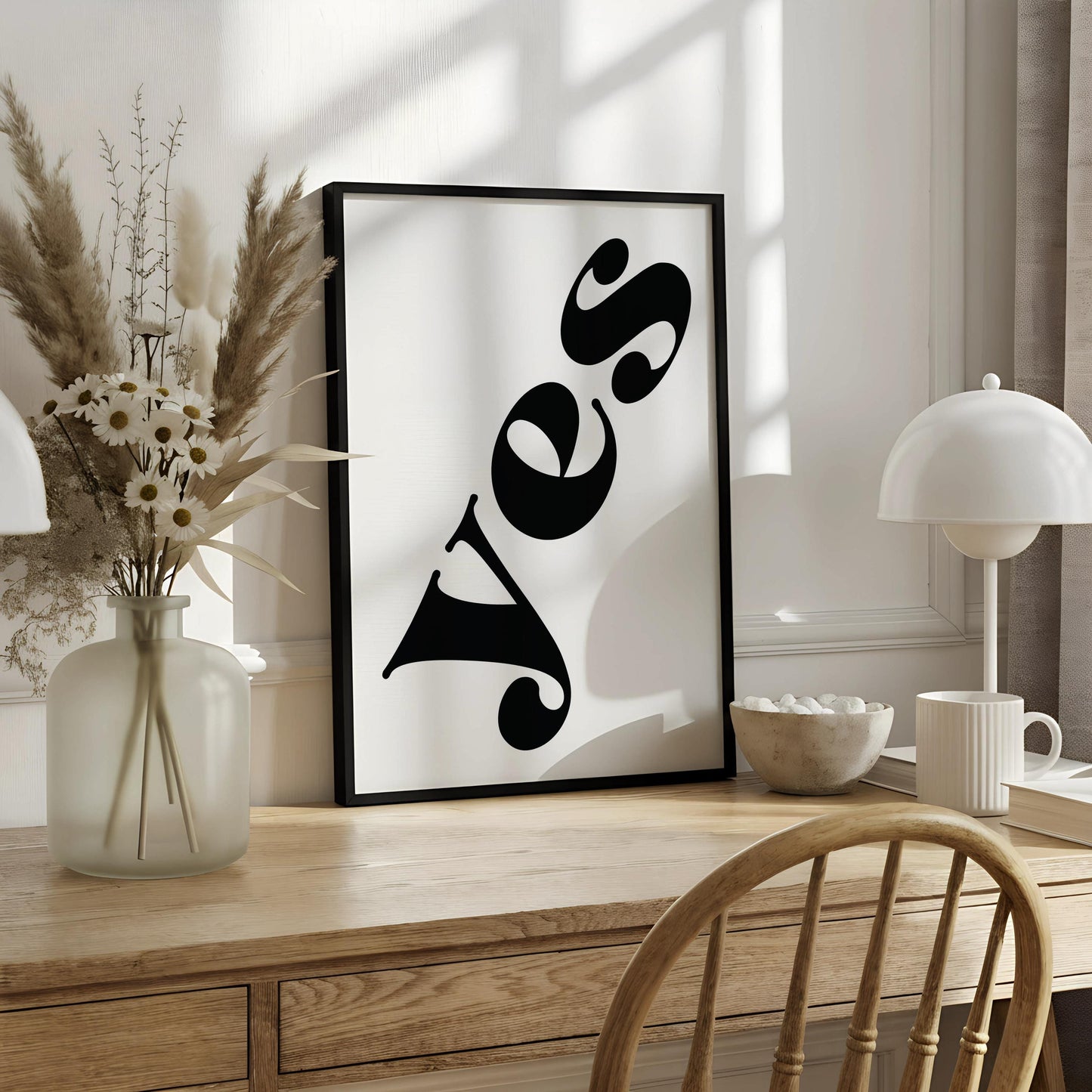 a large, bold, and stylized word "YES" in a black font, which is prominently displayed on a white background.