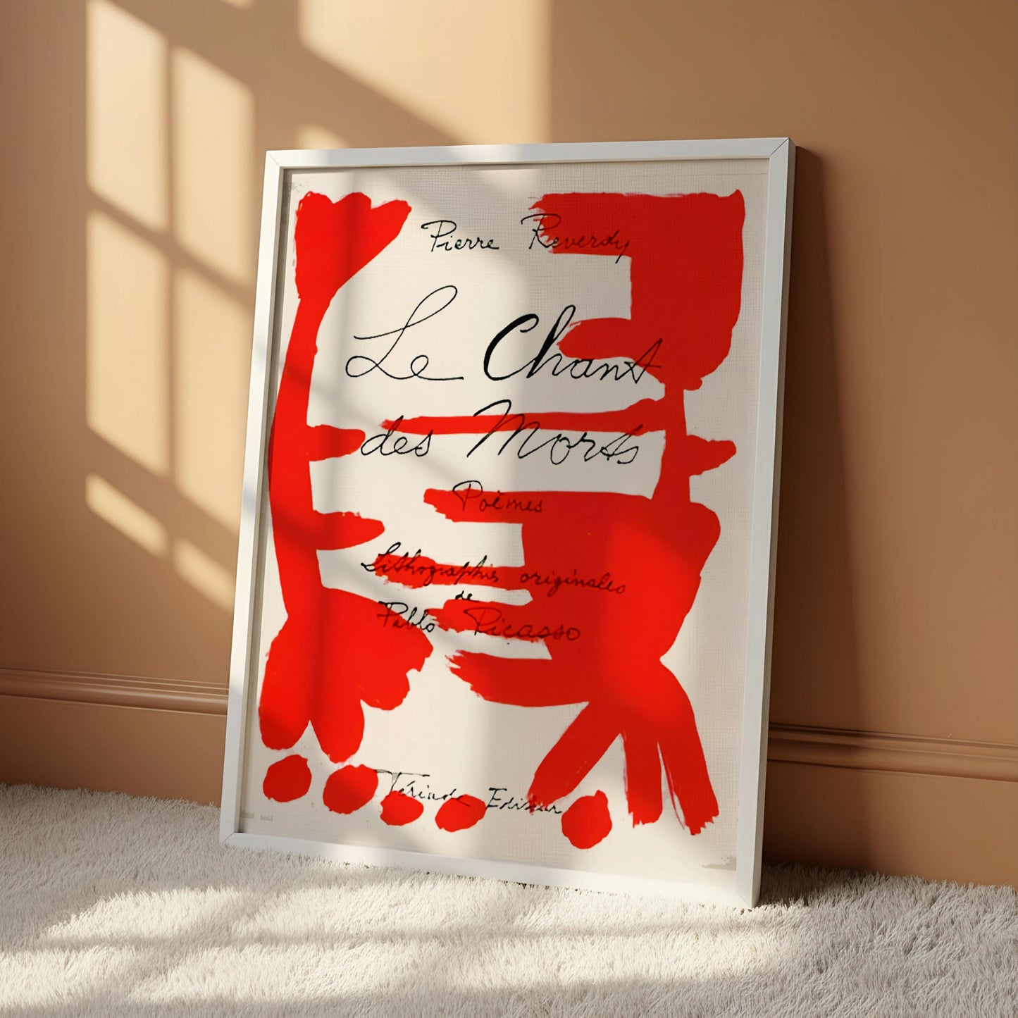 The image is a framed poster with a bold, red abstract design featuring various shapes and lines.
