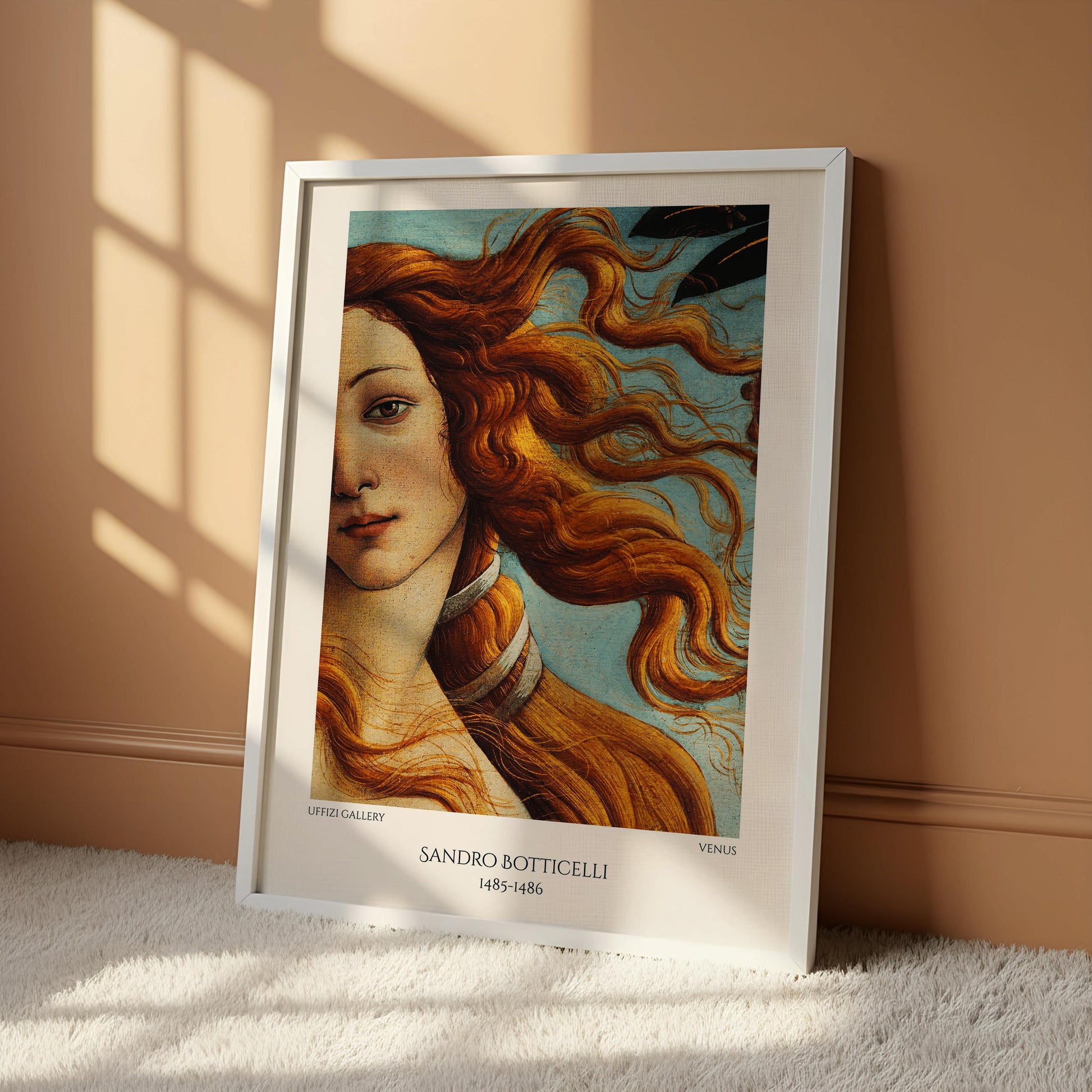 The image is a framed painting of a woman with flowing red hair, depicting the famous painting "The Birth of Venus" by Sandro Botticelli.