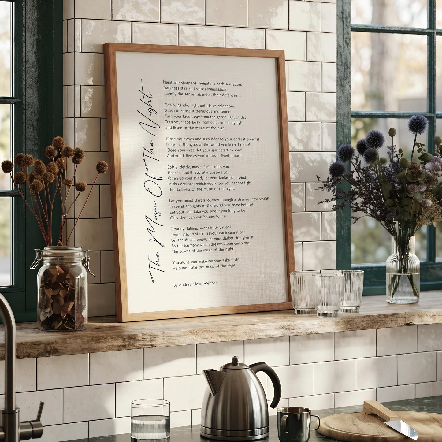 a framed poem titled "The Music of the Night" by Andrew Lloyd Webber, which is a dark and moody piece of literature.