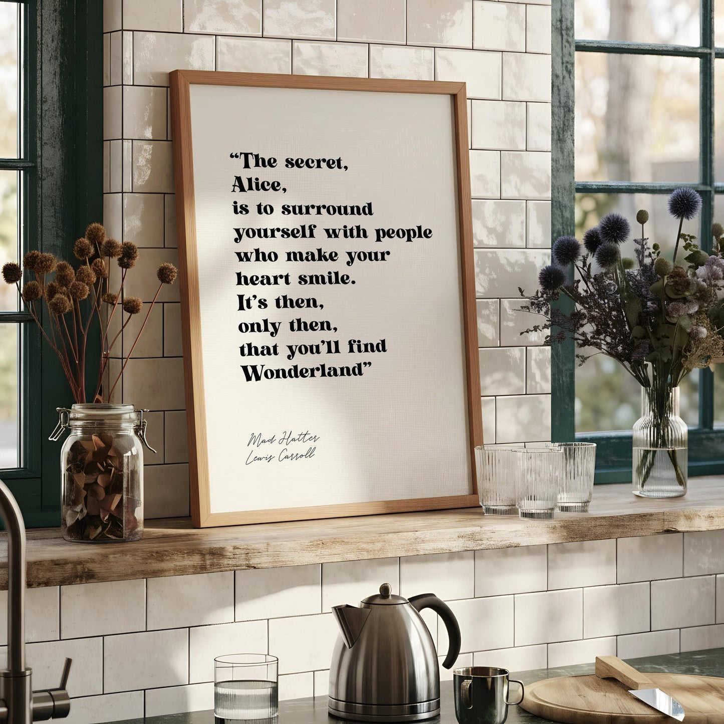 a framed quote by Mad Hatters, Louis Cassill, that reads: "The secret, Alice, is to surround yourself with people who make your heart smile. It's then, only then, that you'll find Wonderland."
